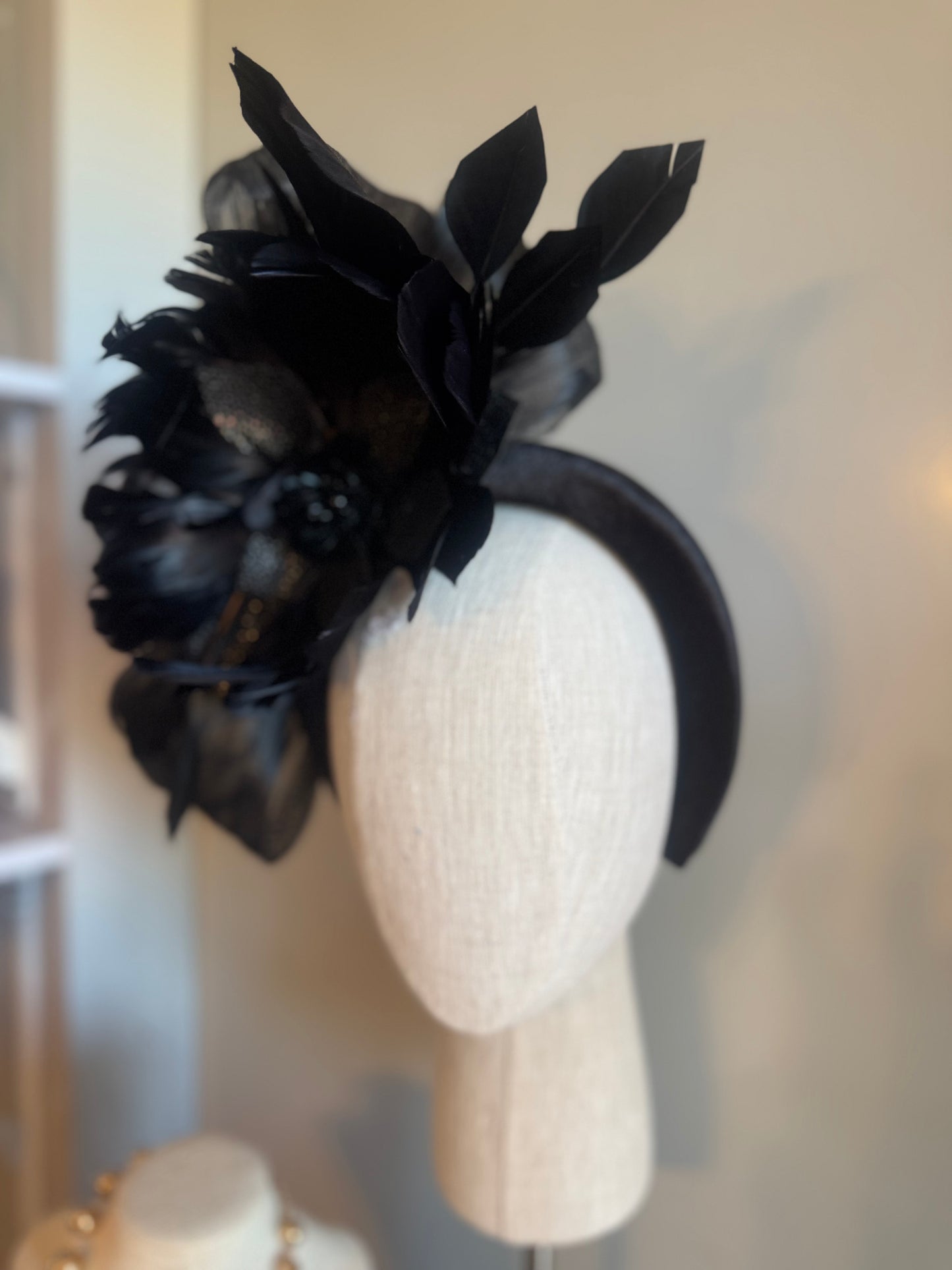“Temple” black feather statement