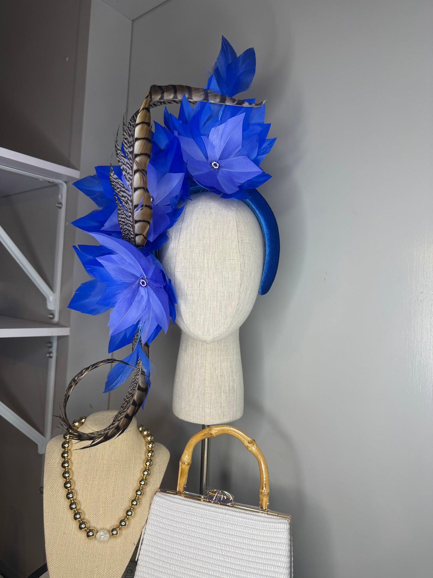 “Lola” blue feather statement