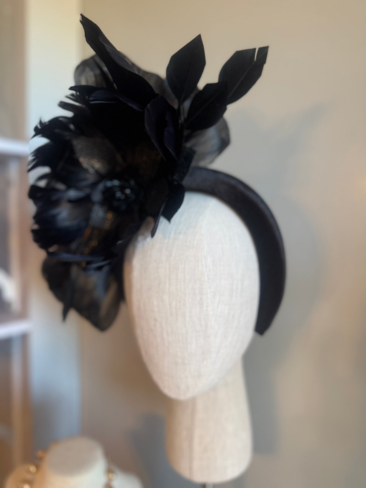 “Temple” black feather statement