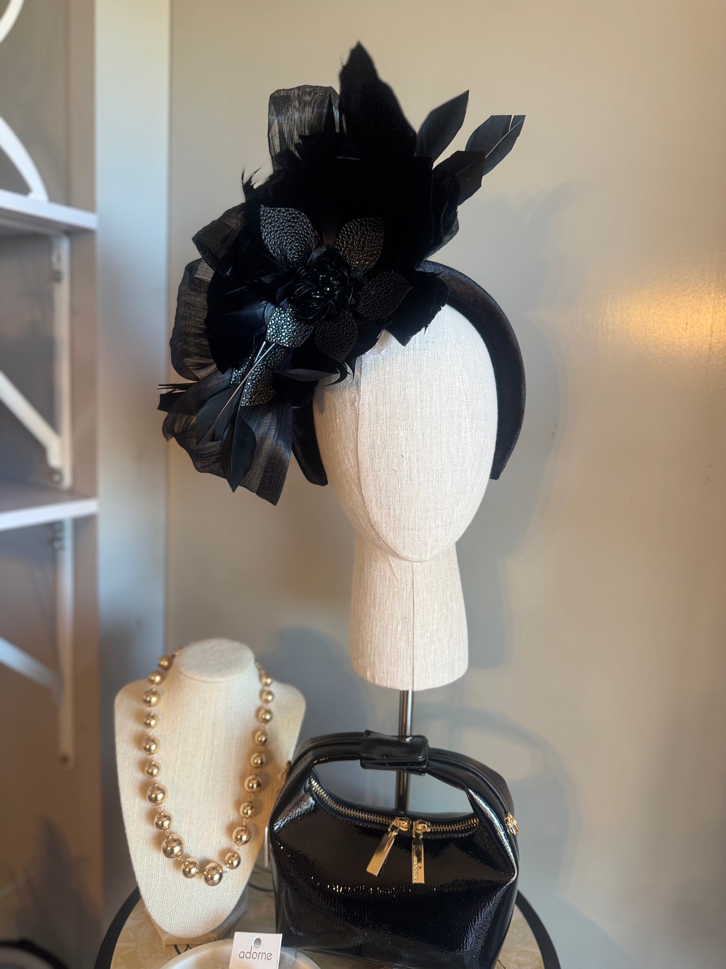 “Temple” black feather statement