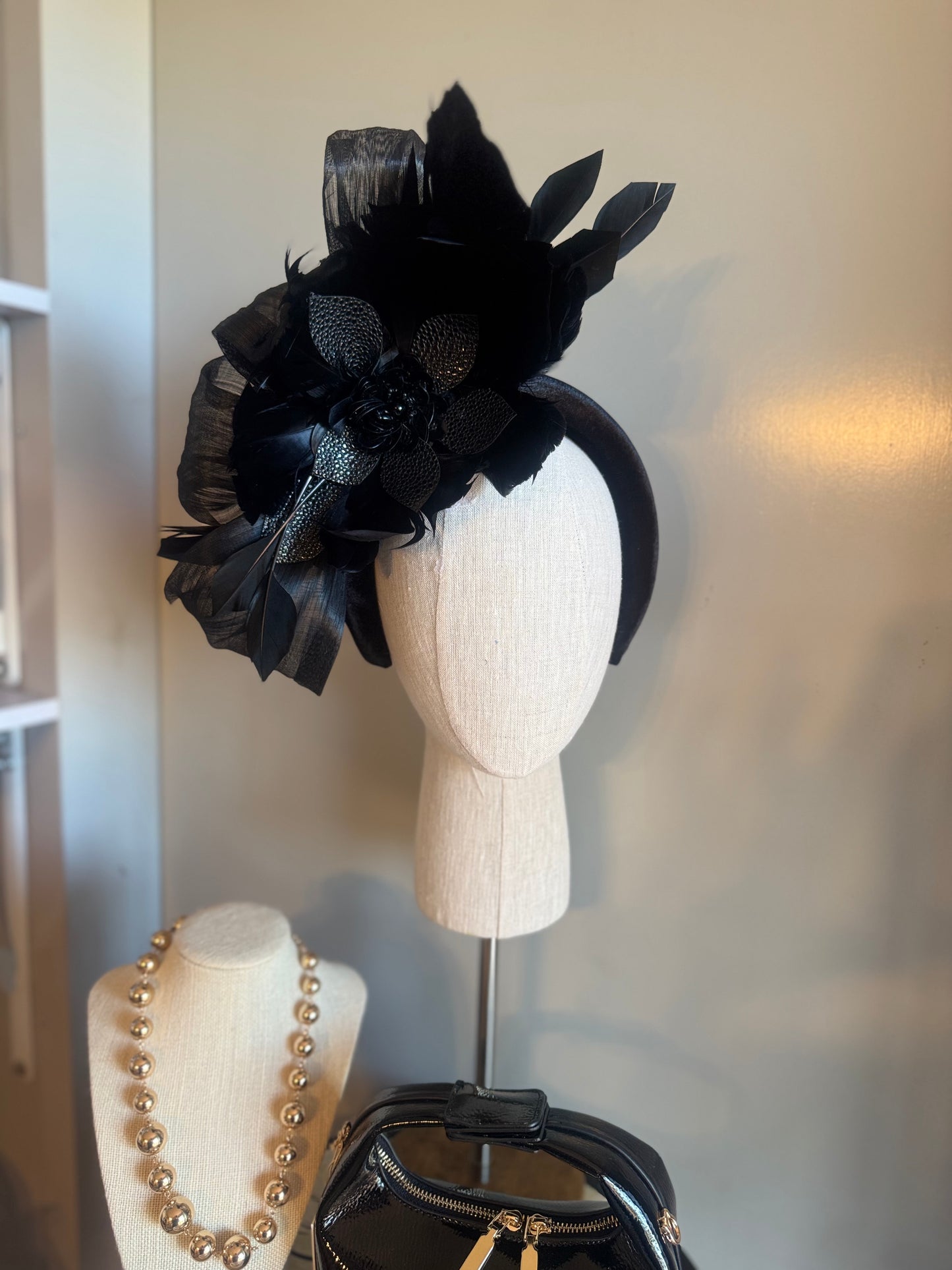 “Temple” black feather statement
