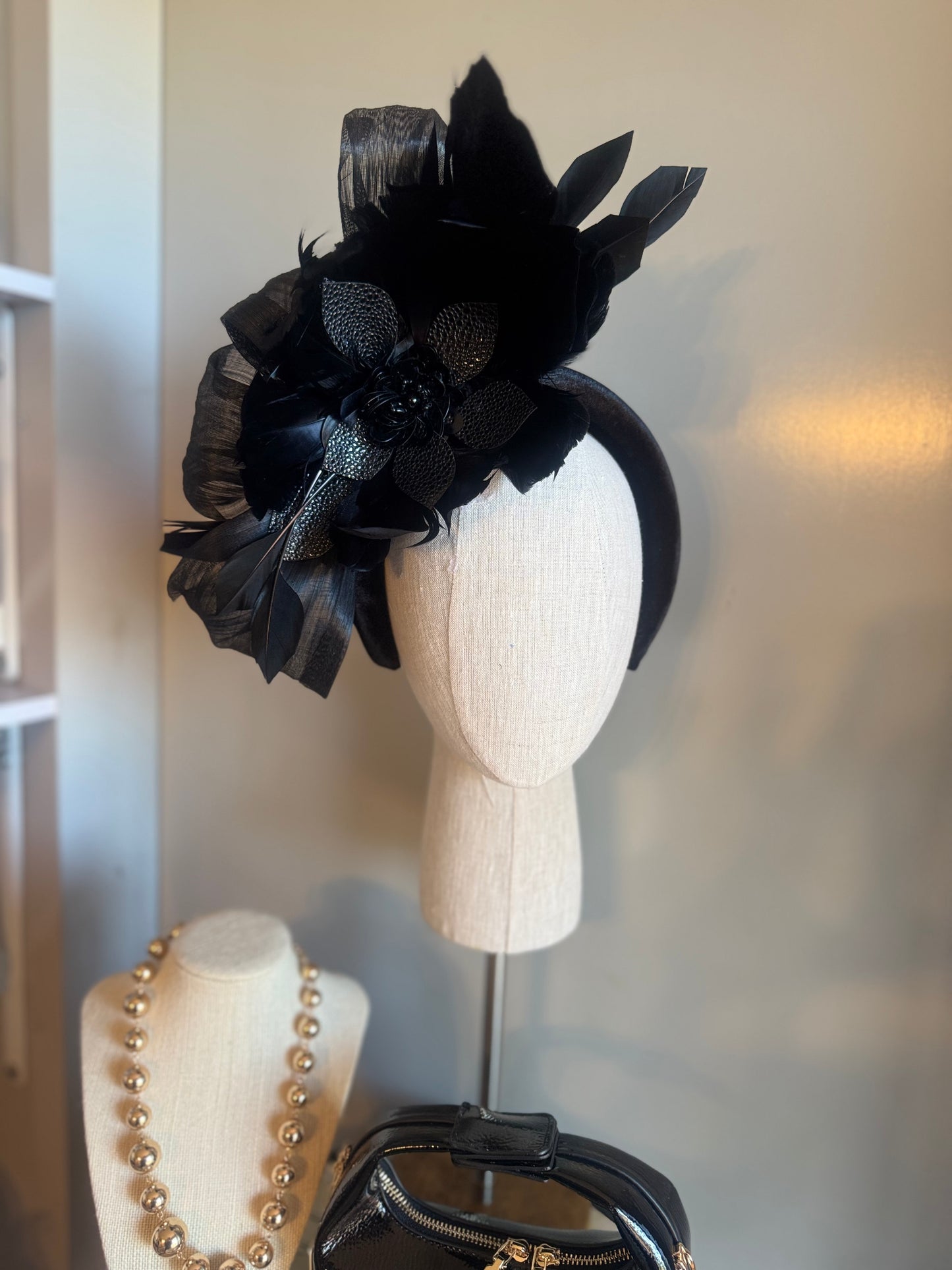 “Temple” black feather statement