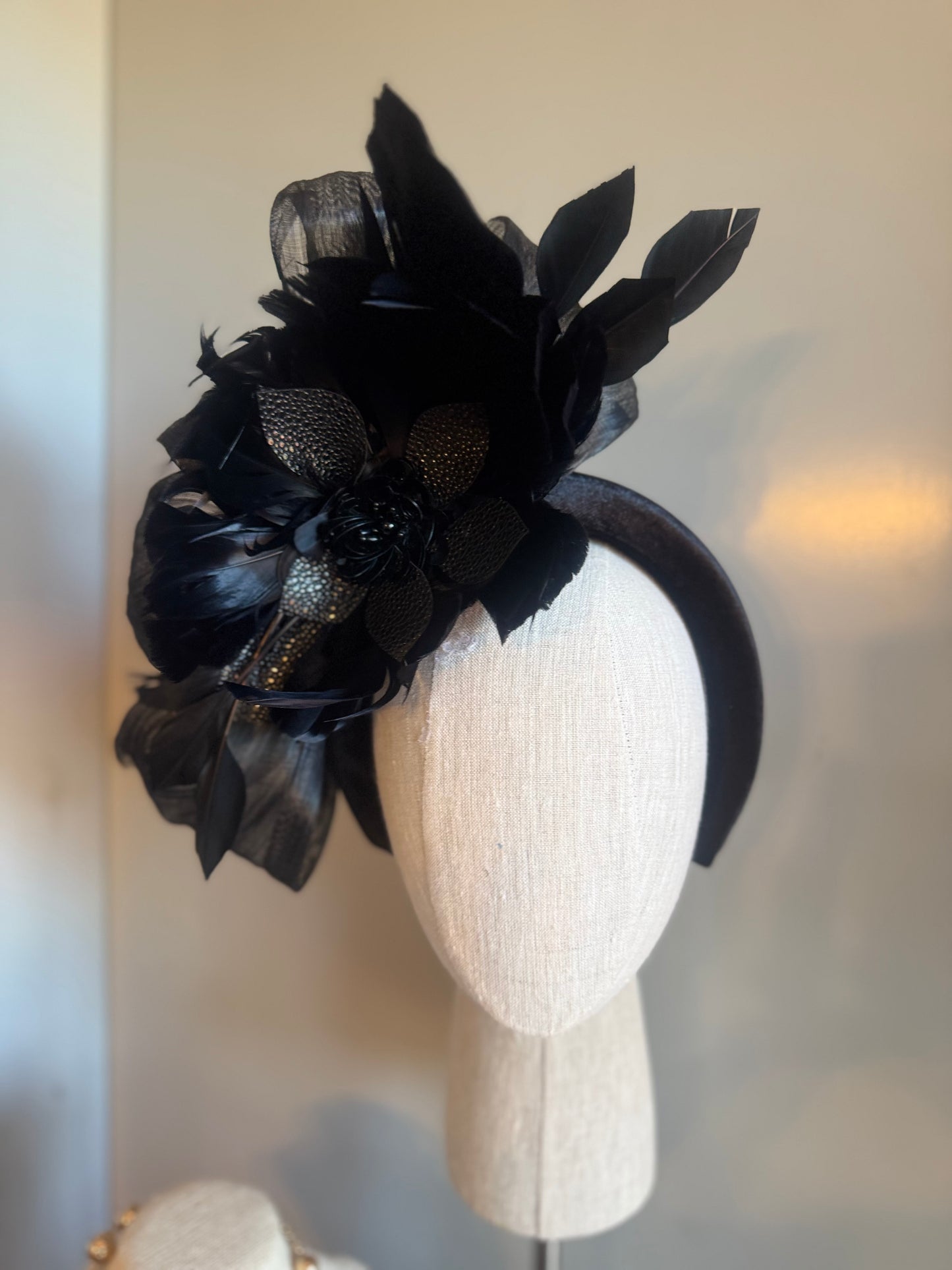 “Temple” black feather statement