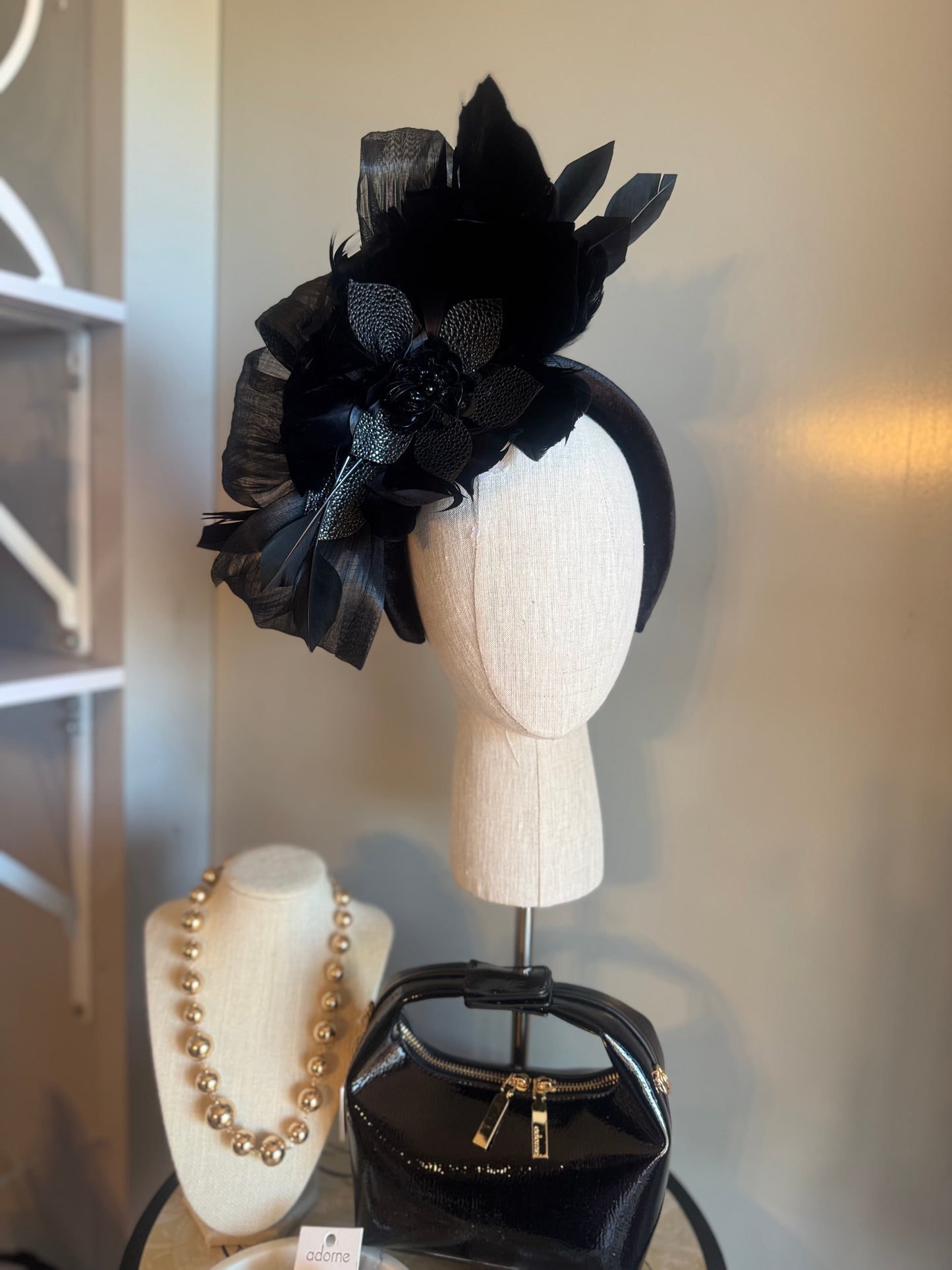 “Temple” black feather statement