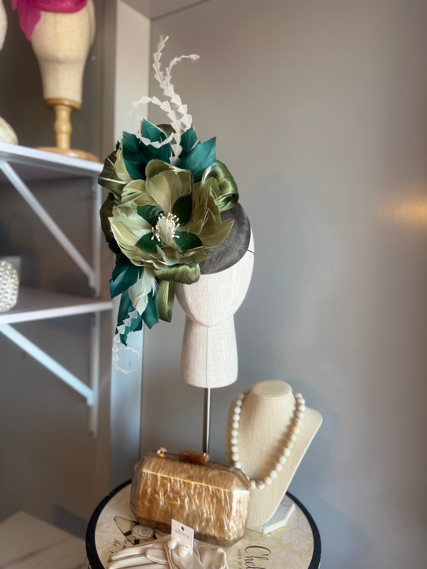 “August” green feather statement