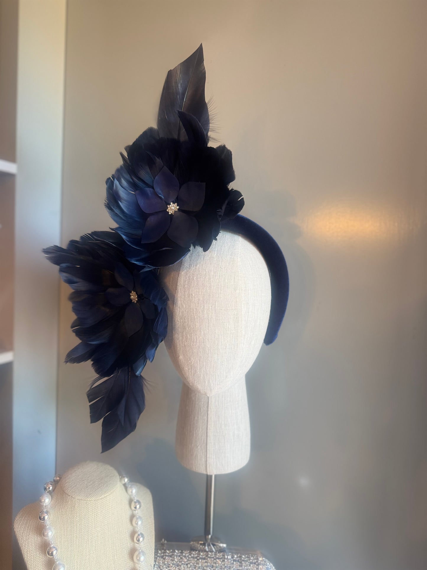 “Maggie” Navy feather statement