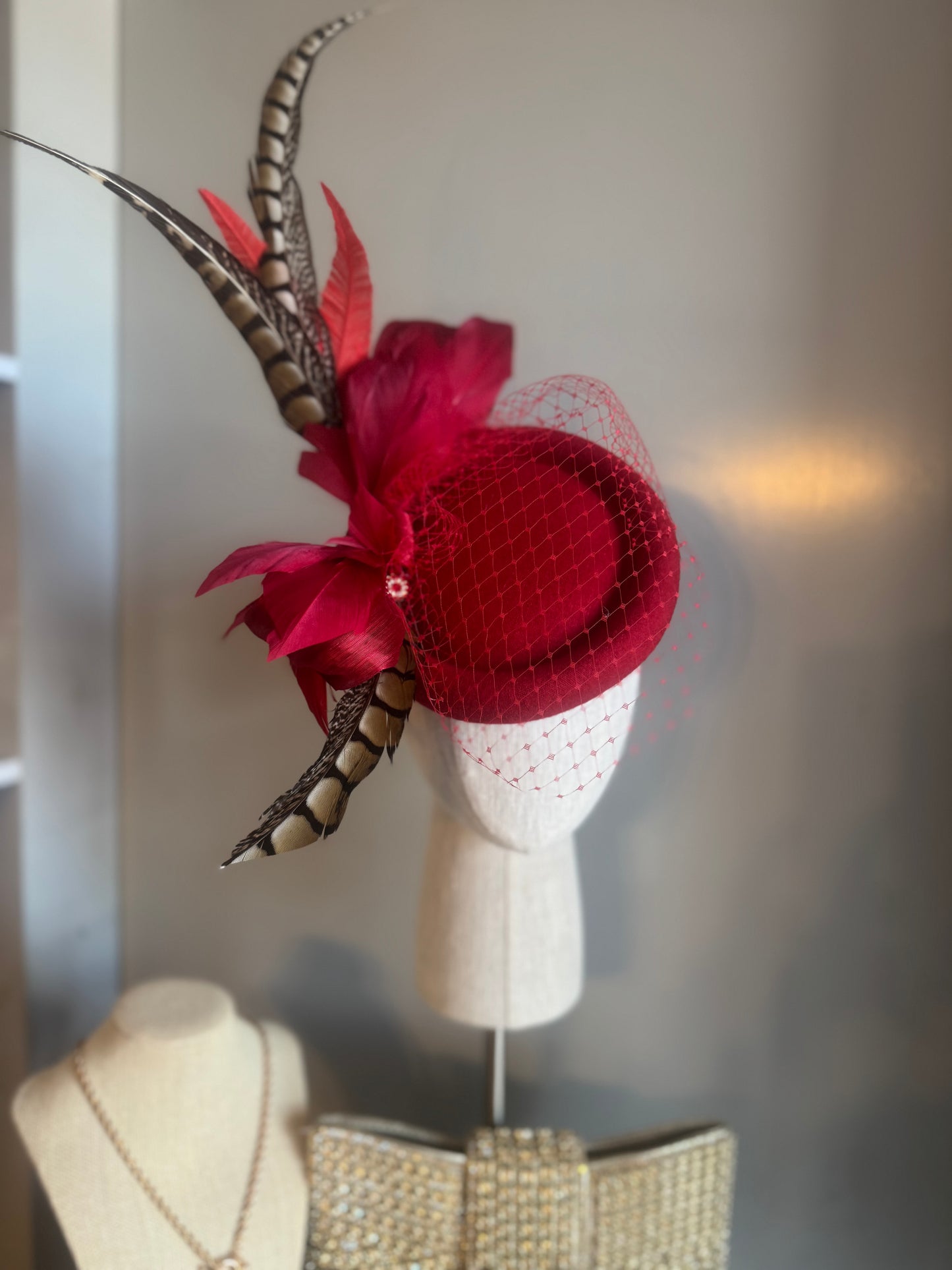 “Jaclyn” red feather statement