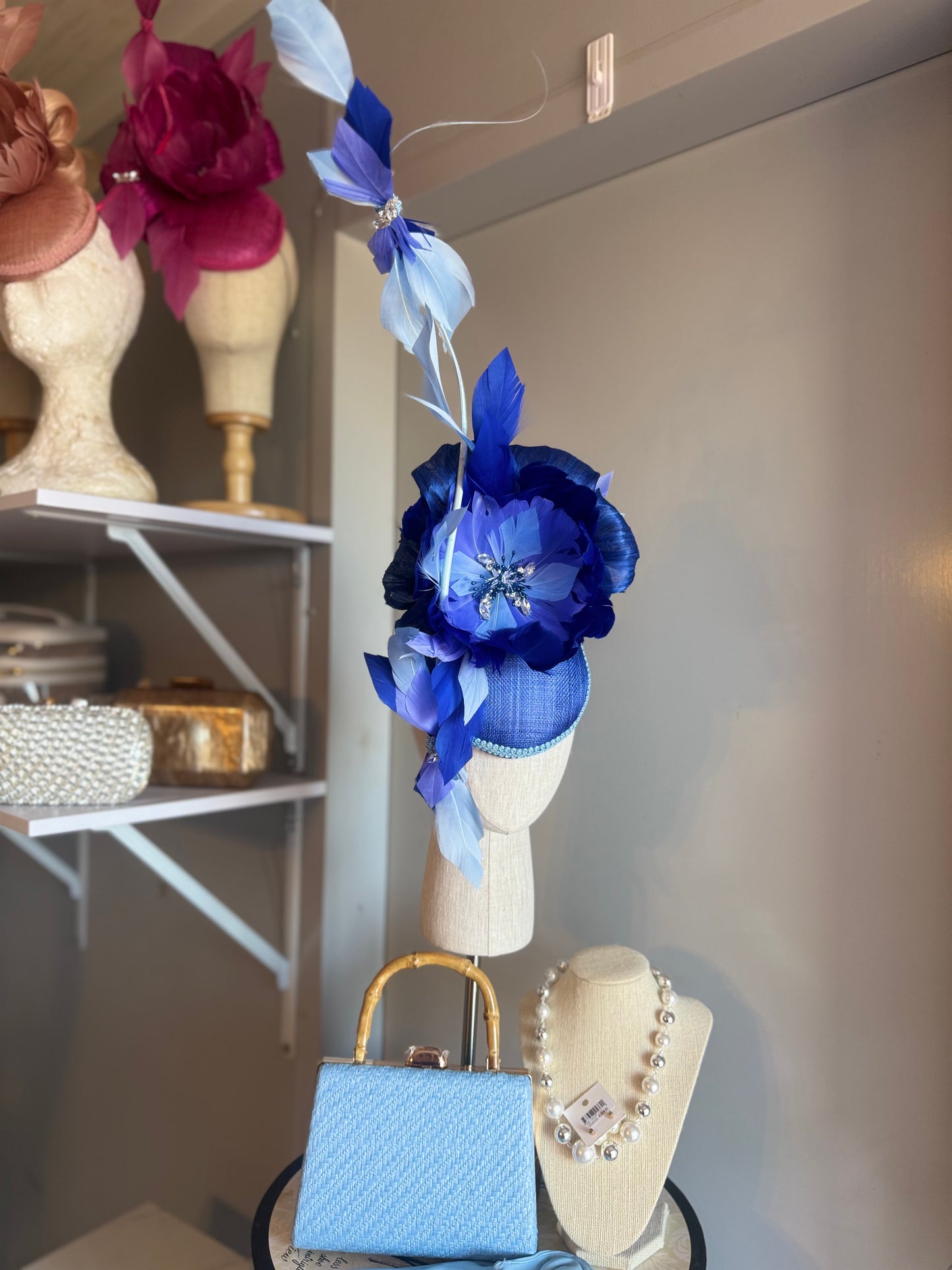 “Wren” blue feather statement
