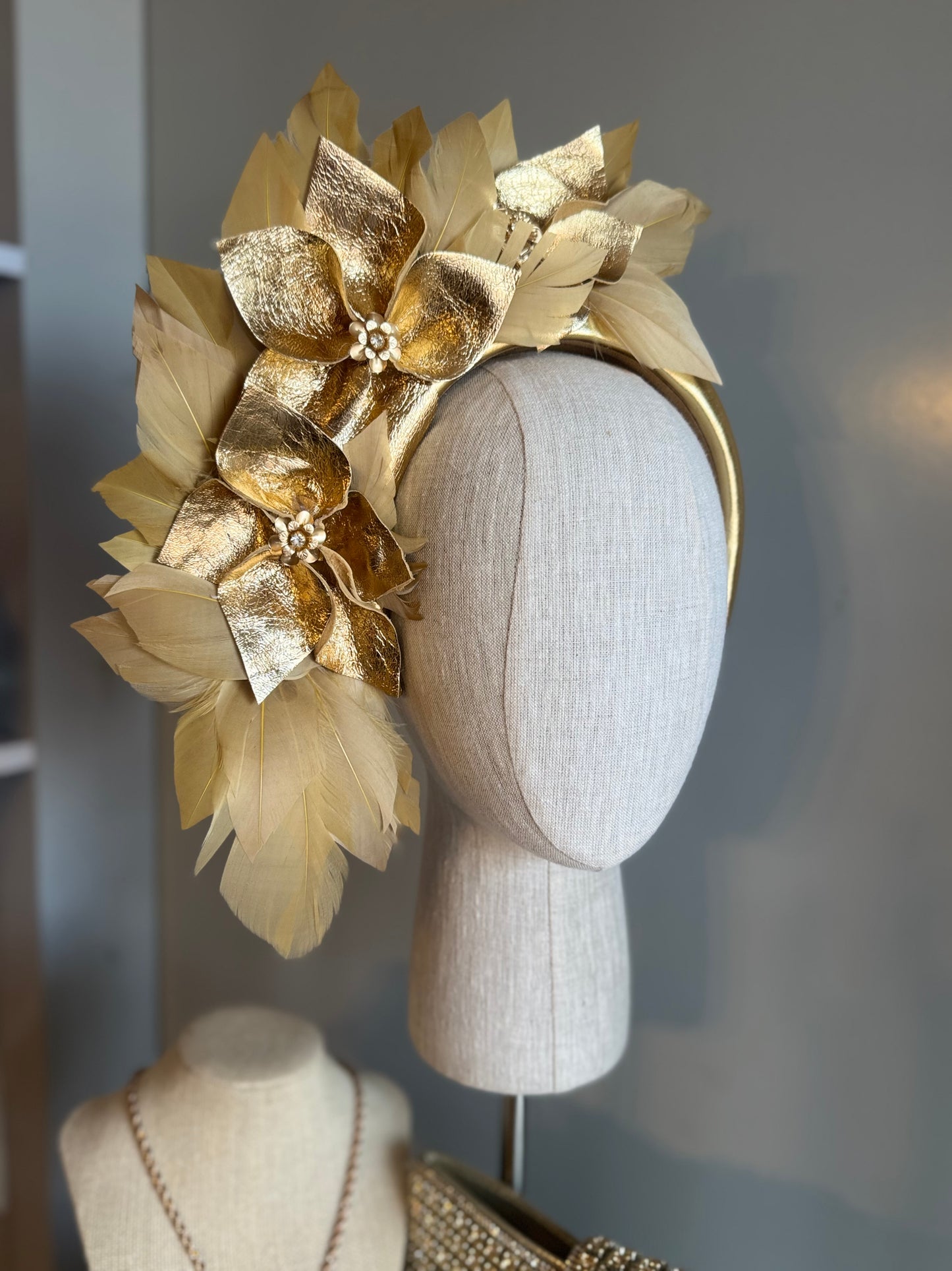 “Anna”Gold leather and feather statement