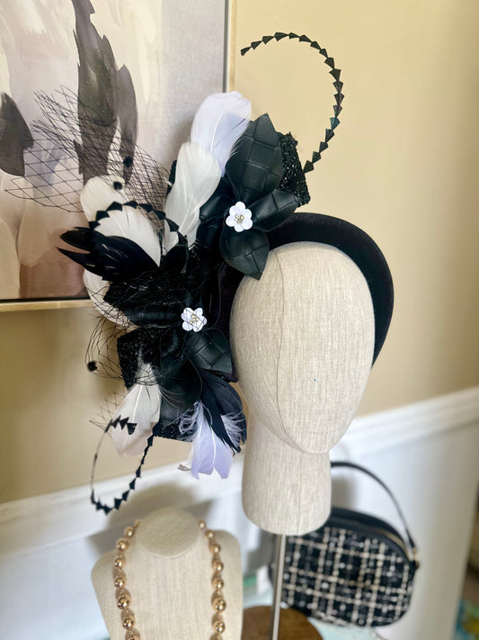 “Taniesha” black and white pleather feather floral