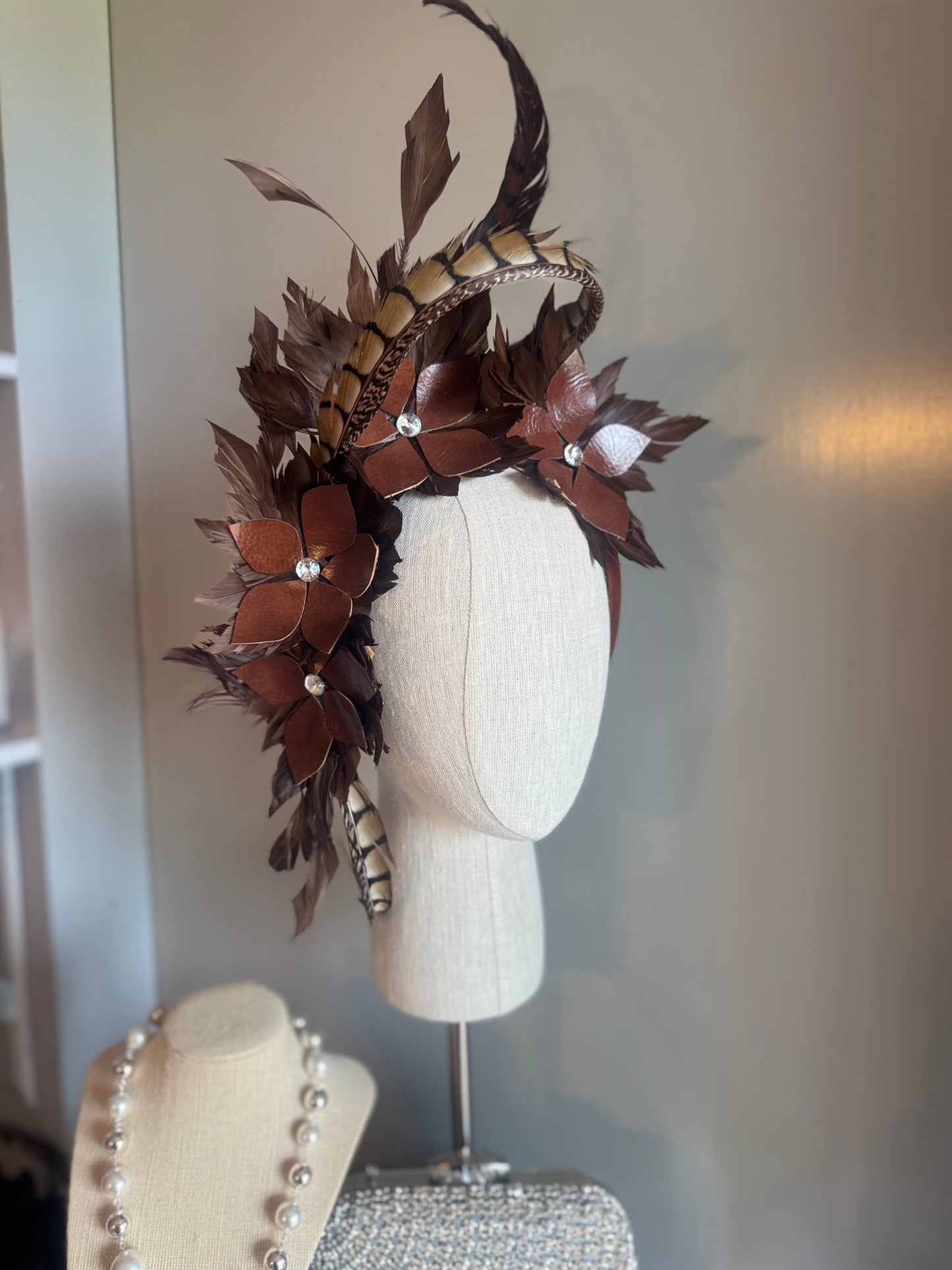 “Tempi” brown feather statement pillbox