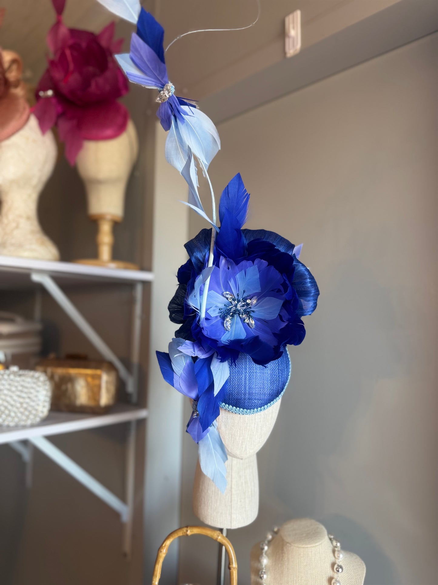 “Wren” blue feather statement