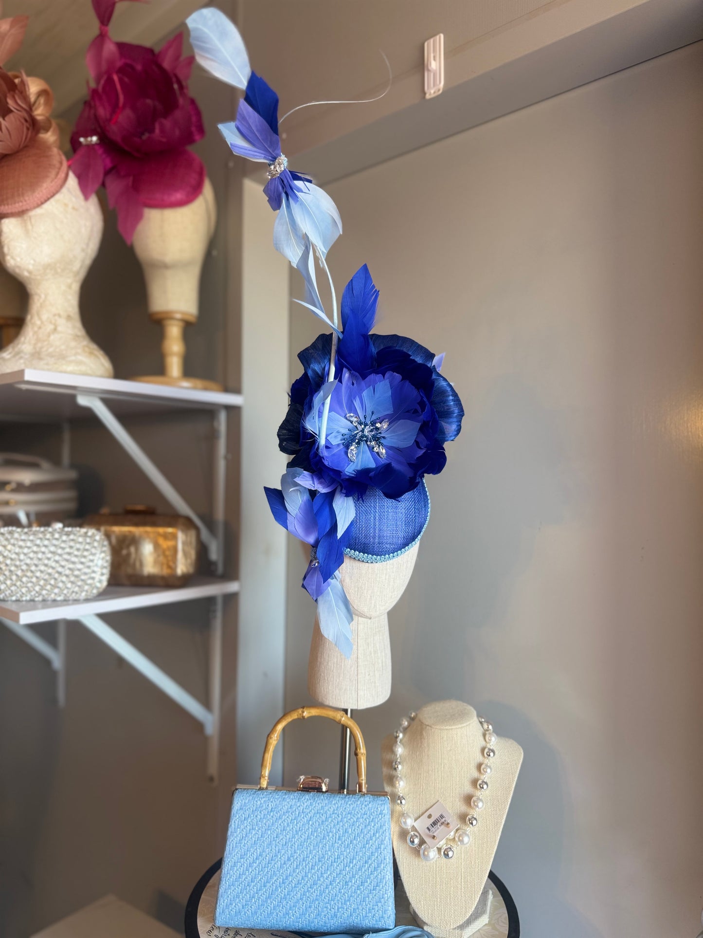 “Wren” blue feather statement