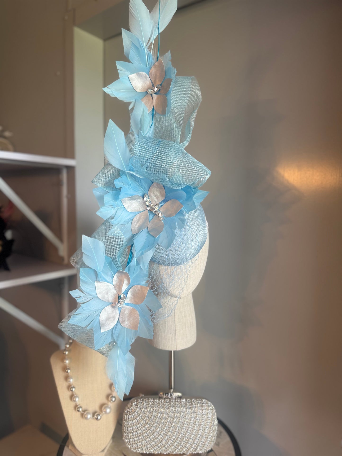 “Claudia” blue silver feather statement