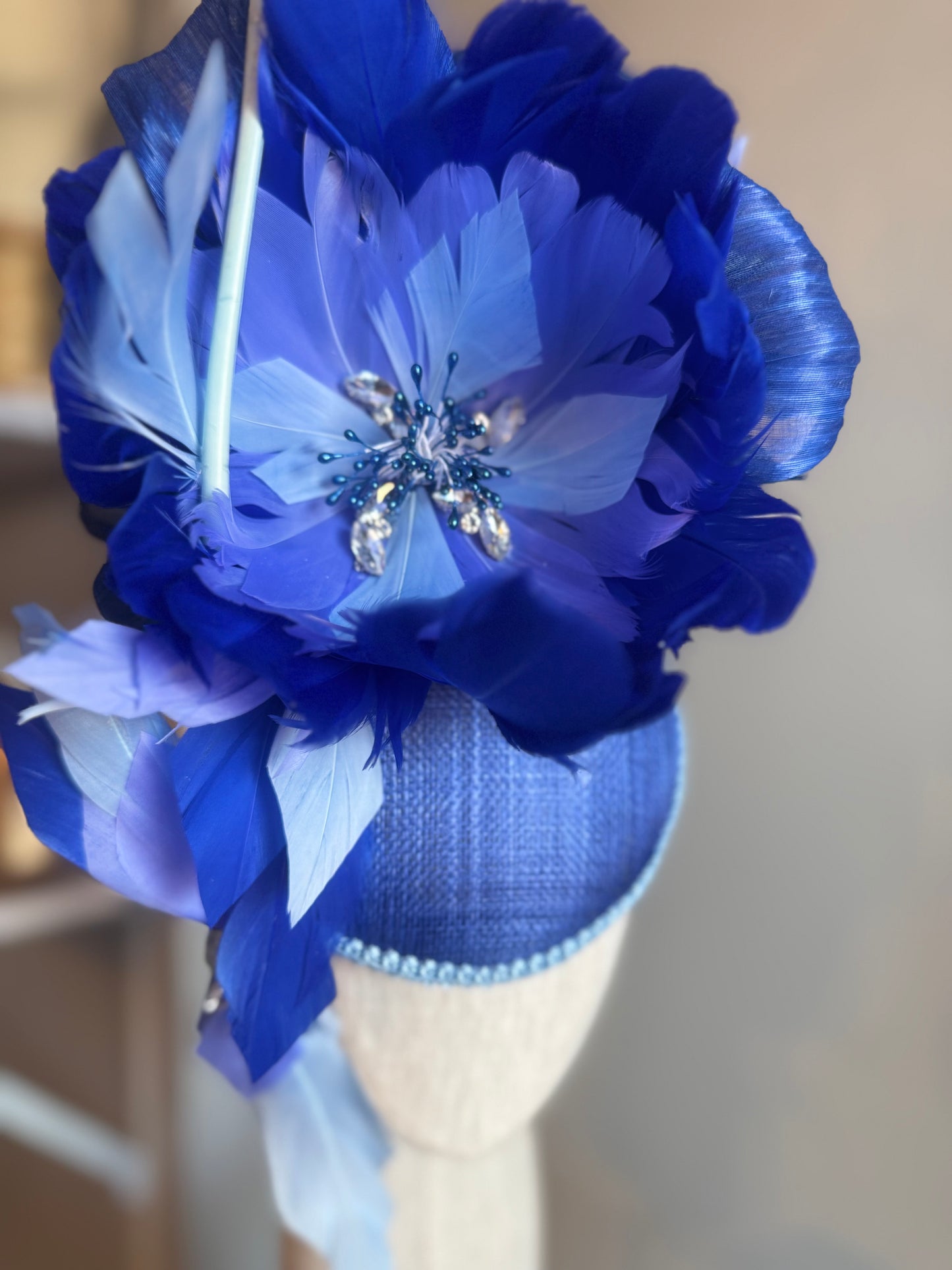 “Wren” blue feather statement