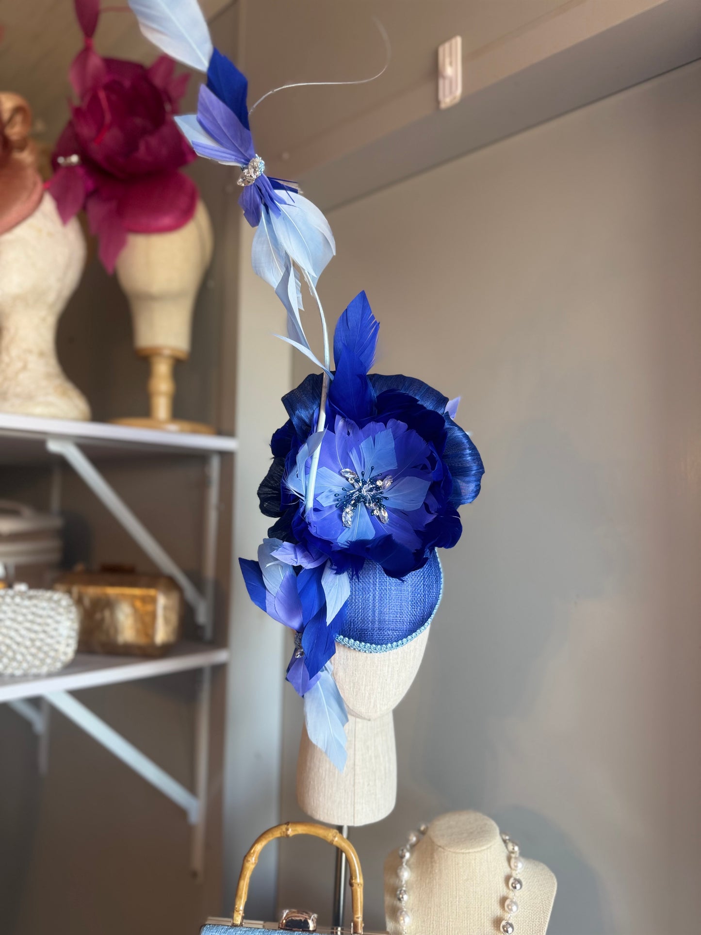 “Wren” blue feather statement
