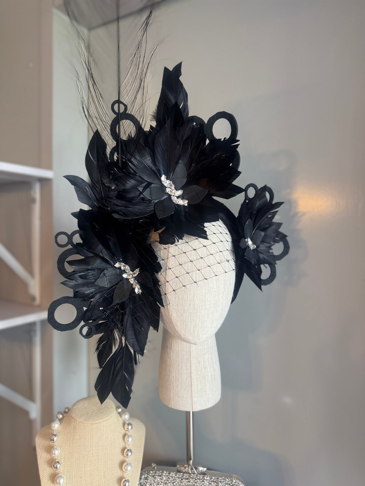 “Odette” Black and silver feather statement