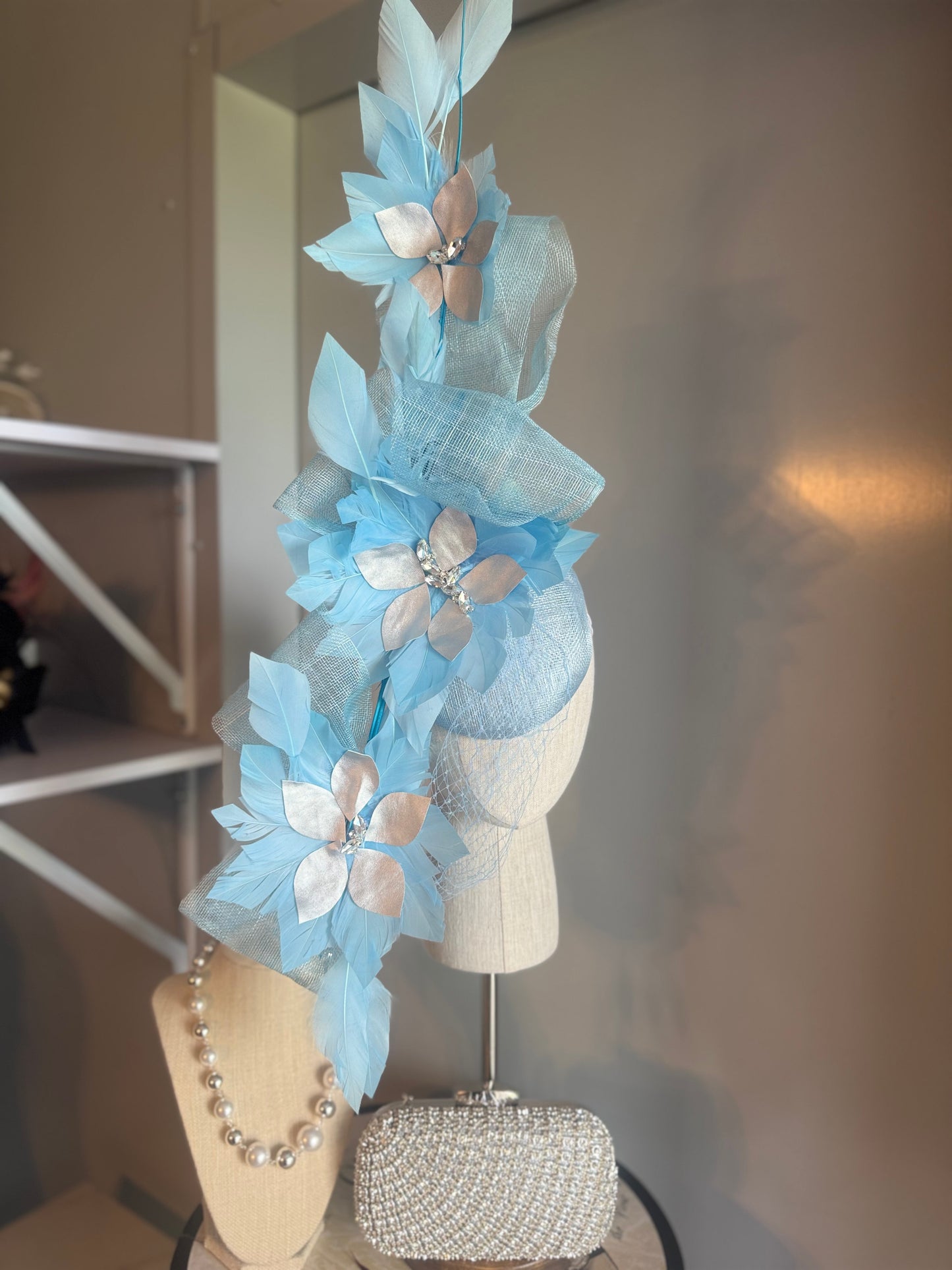 “Claudia” blue silver feather statement
