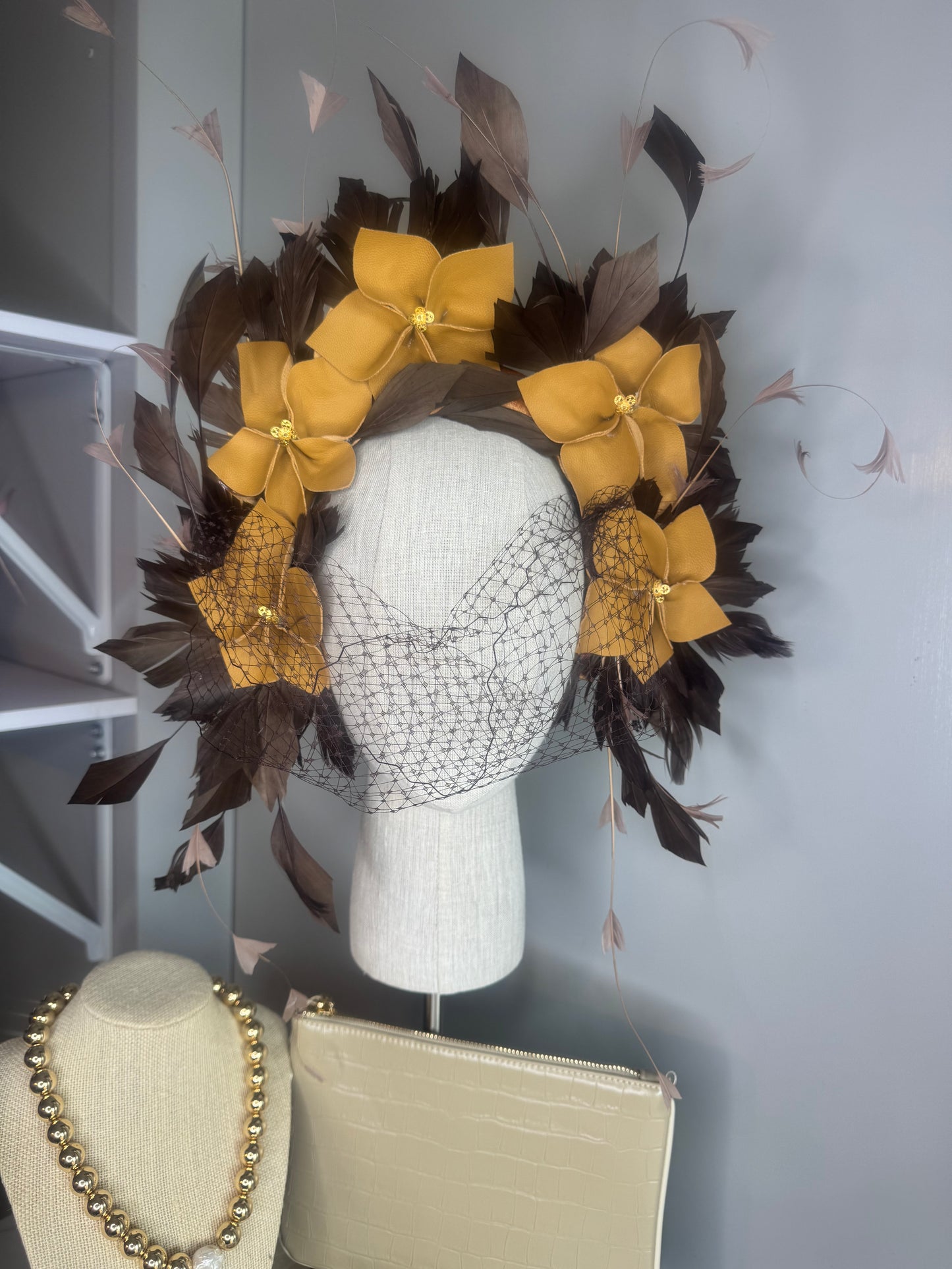 “Pippa” caramel mustard & chocolate leather & feather statement