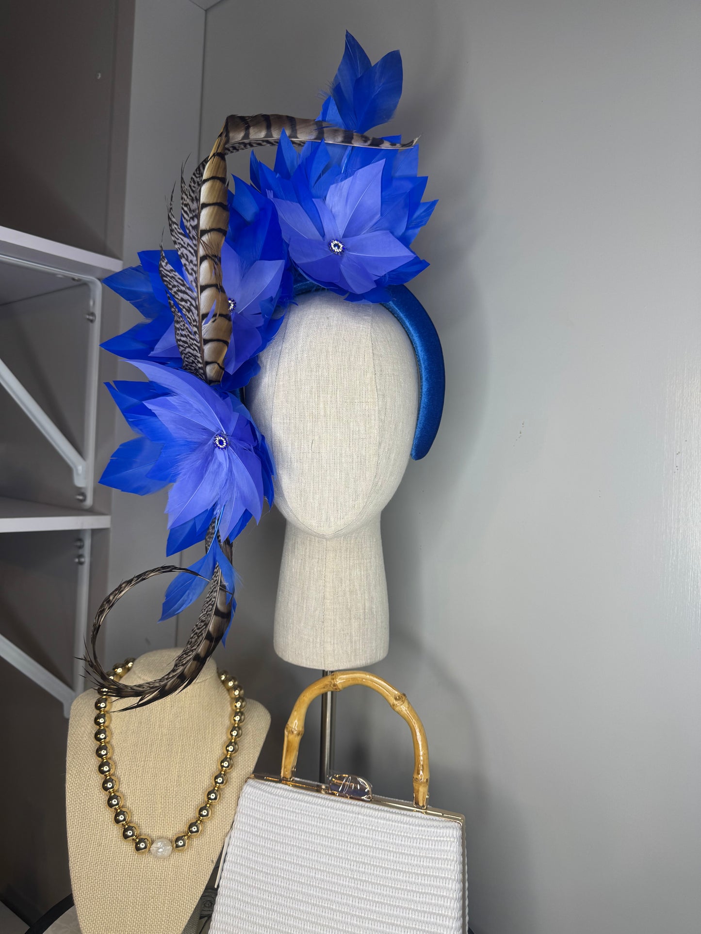 “Lola” blue feather statement