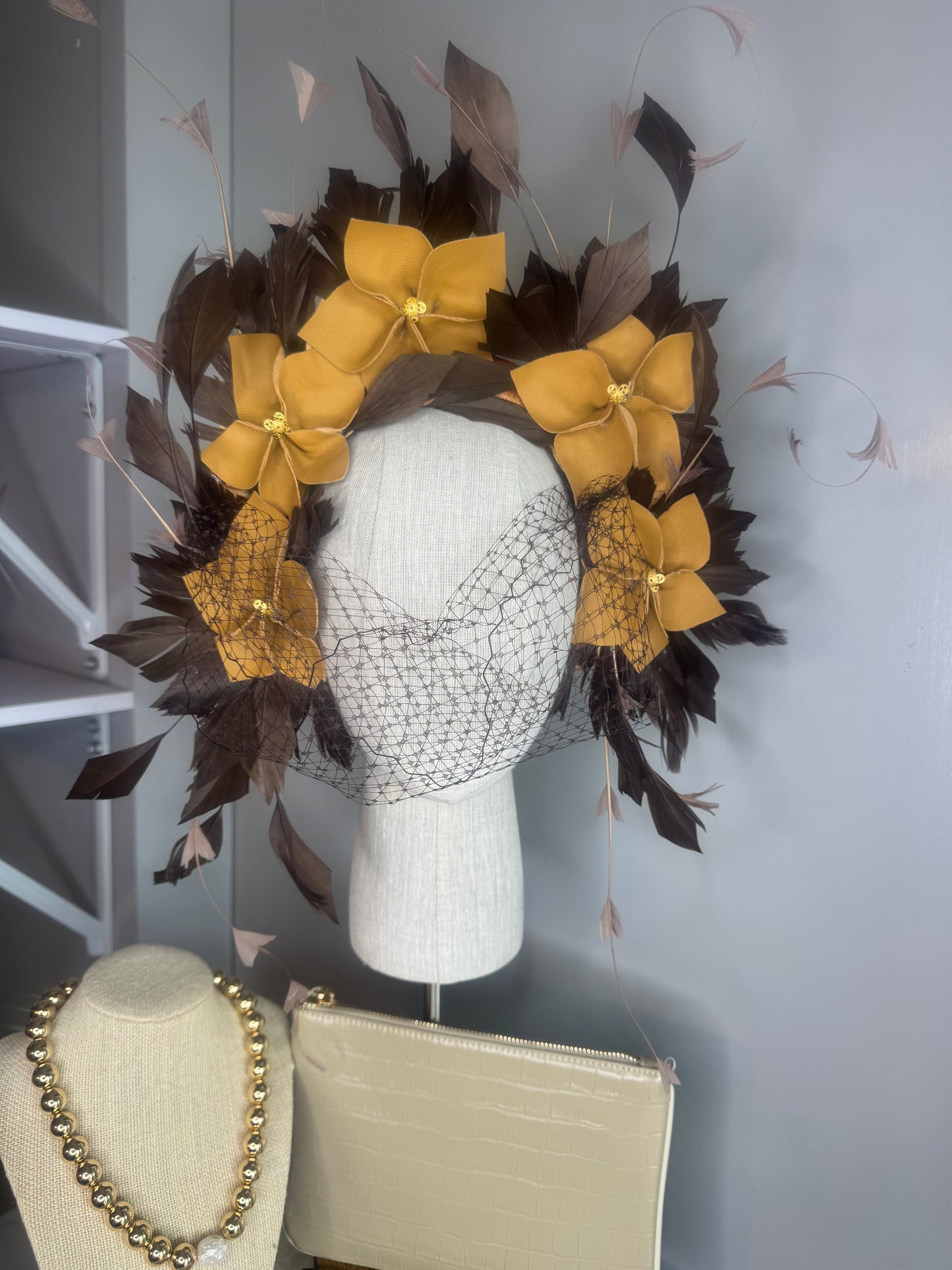 “Pippa” caramel mustard & chocolate leather & feather statement