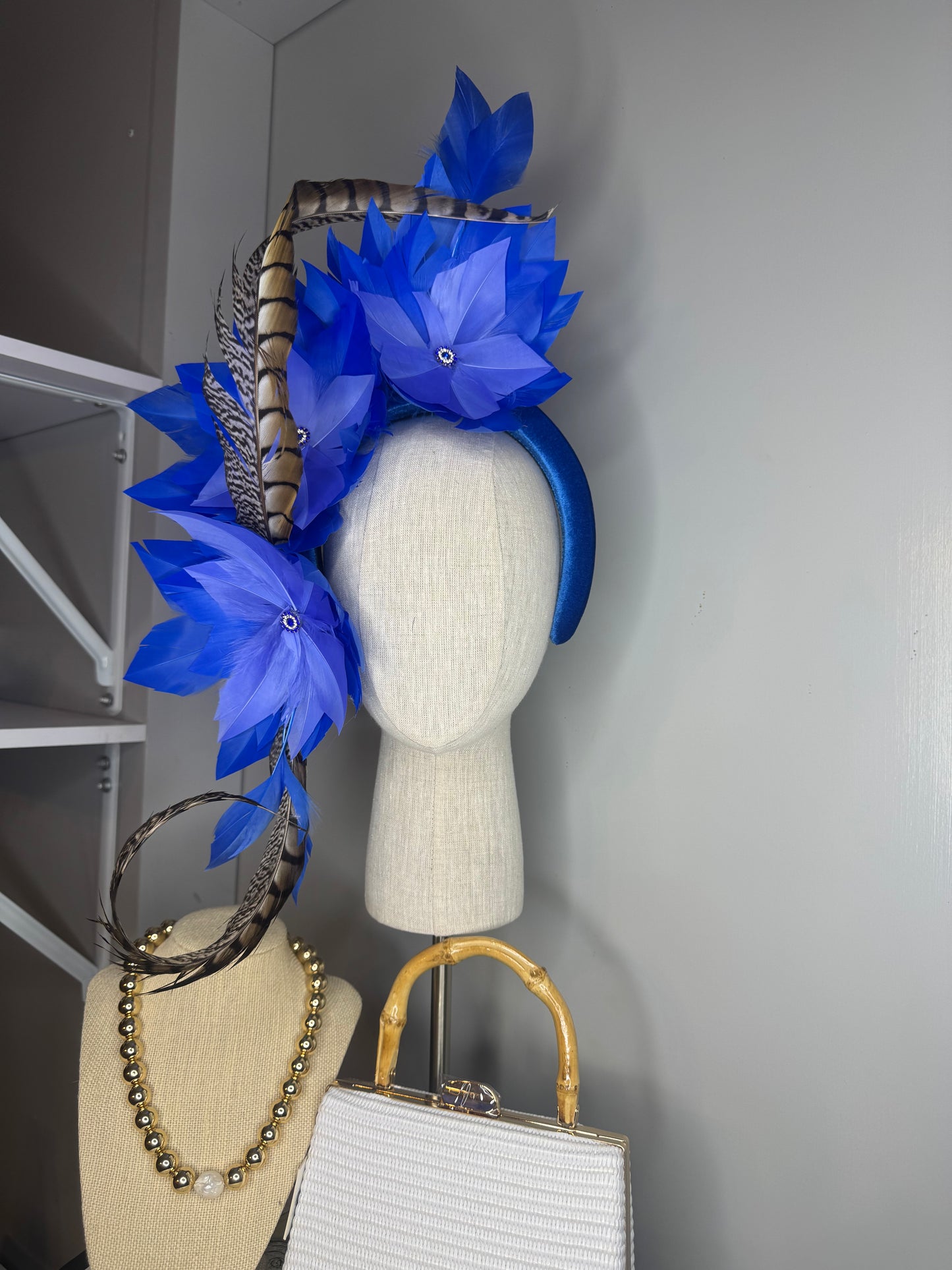 “Lola” blue feather statement