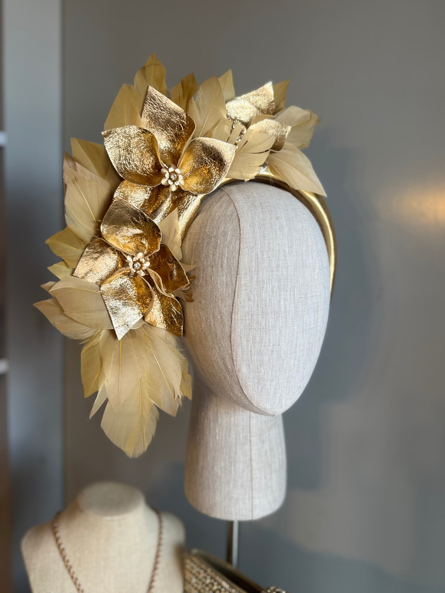 “Anna”Gold leather and feather statement