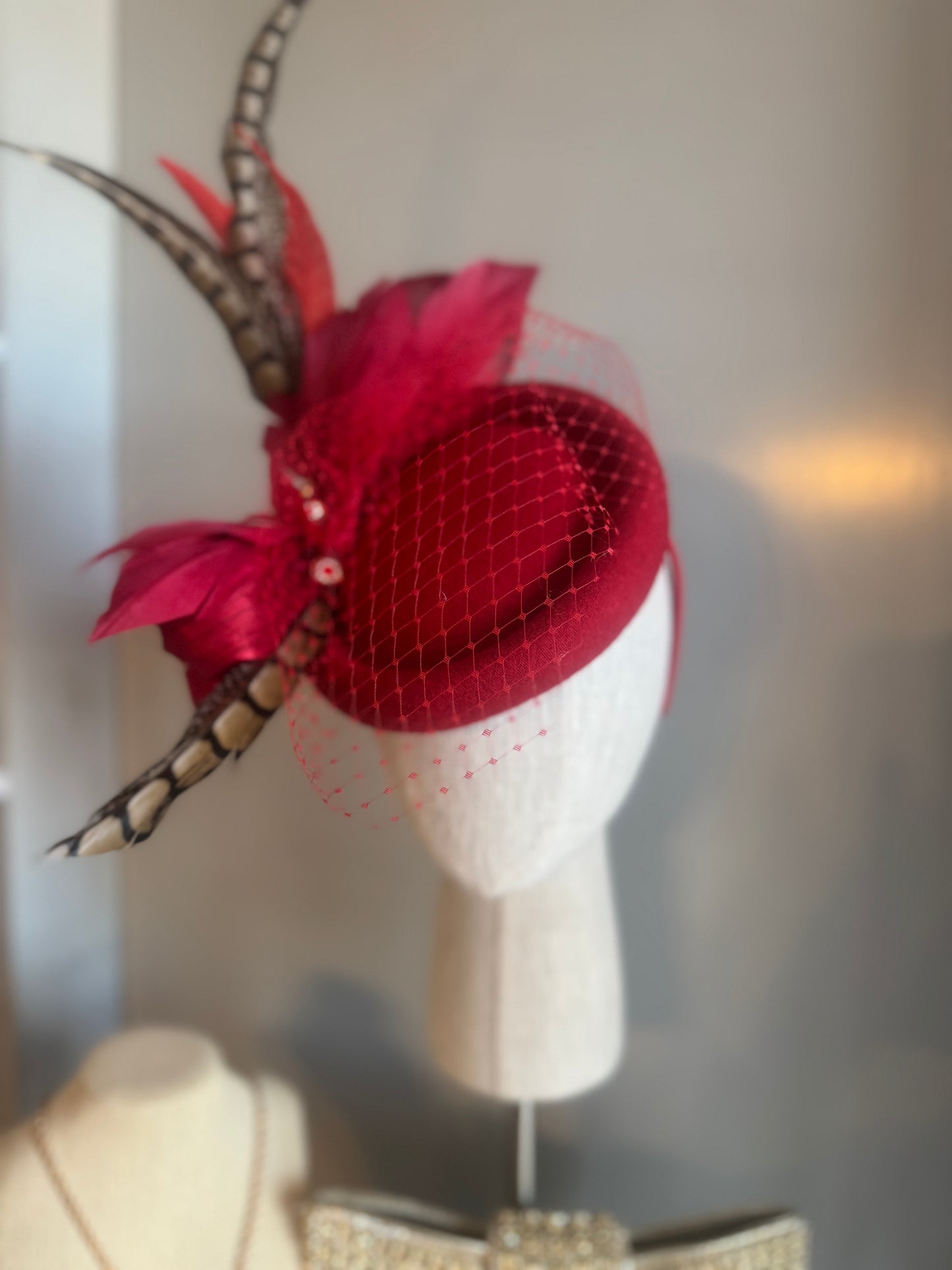 “Jaclyn” red feather statement