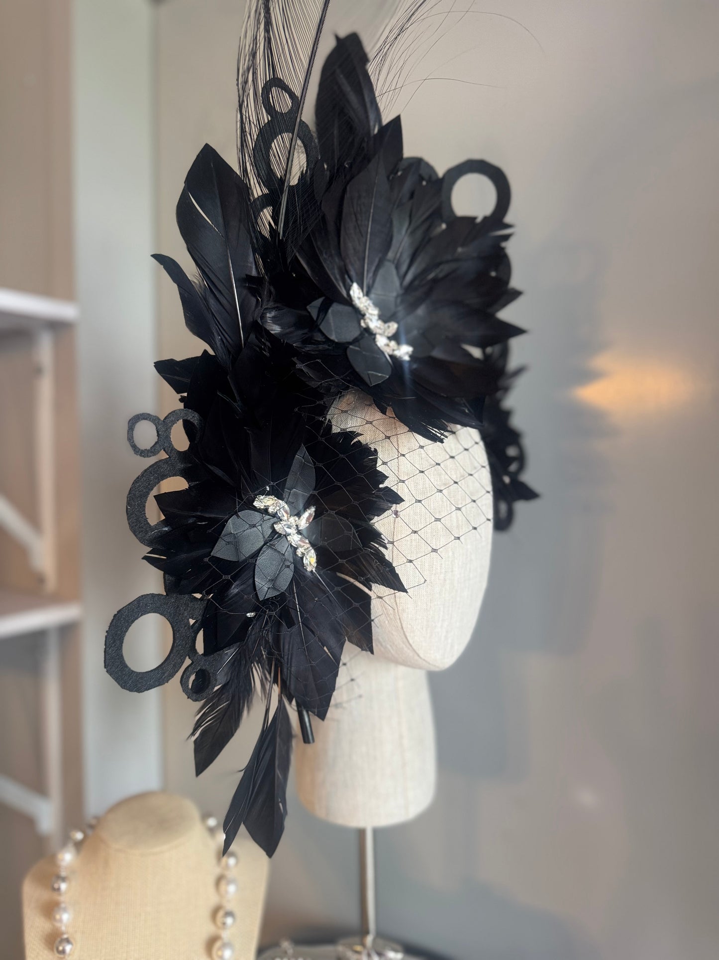 “Odette” Black and silver feather statement