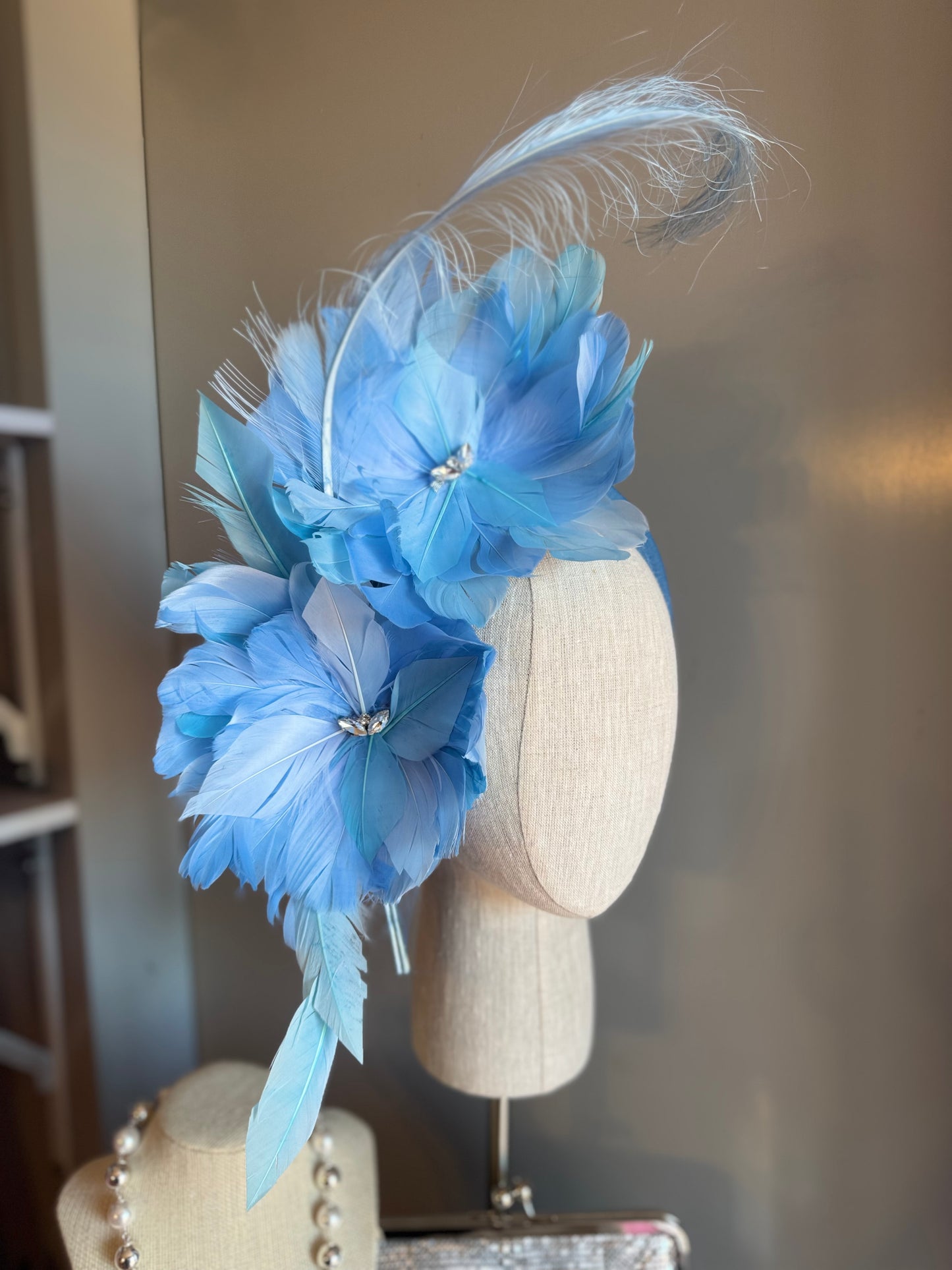 “Gracie” blue feather statement