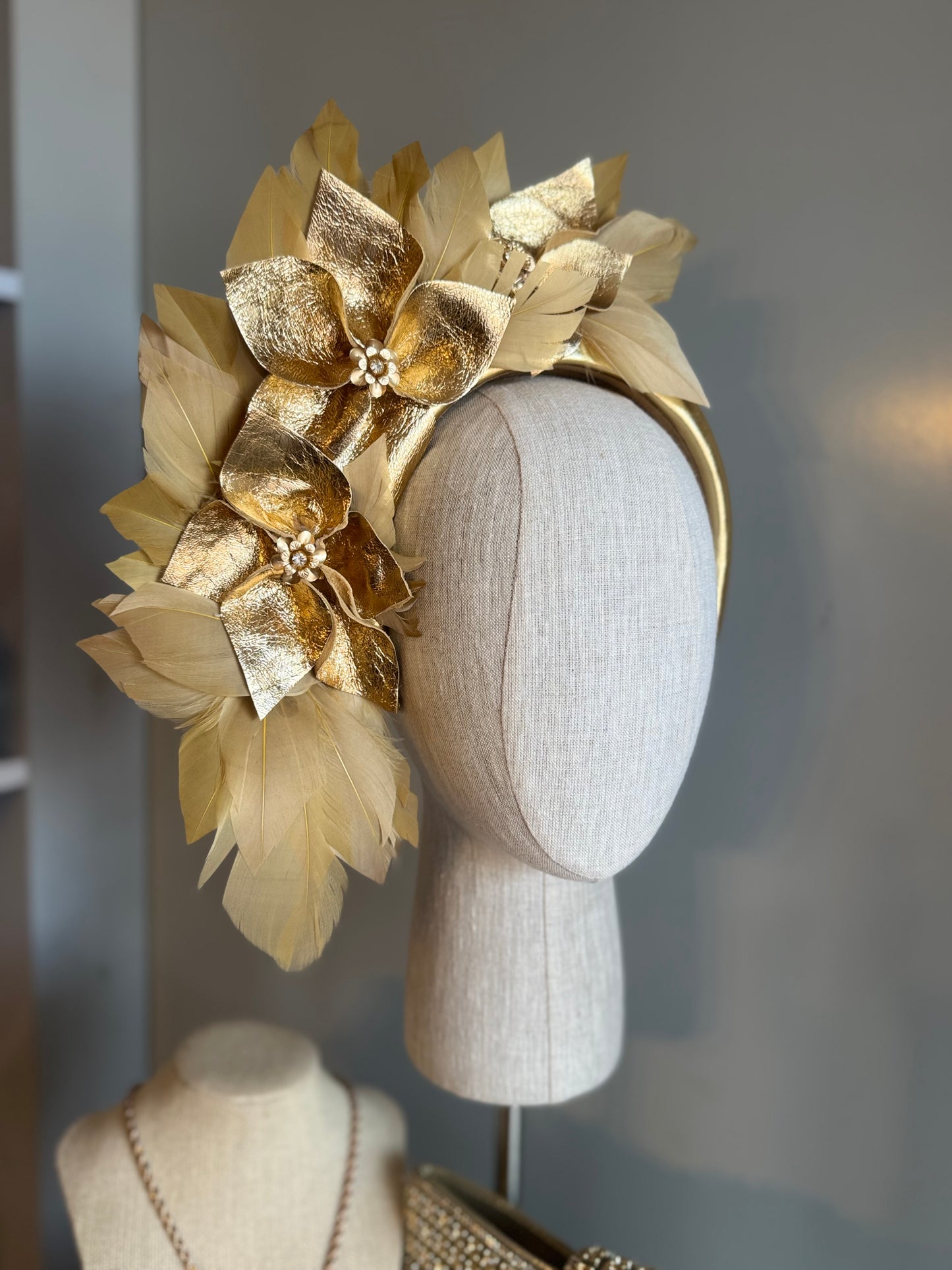 “Anna”Gold leather and feather statement