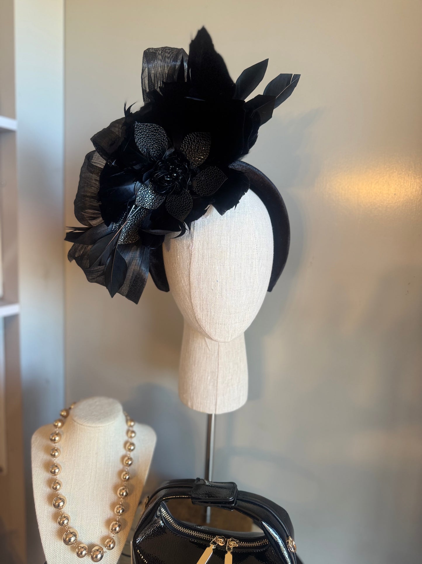 “Temple” black feather statement