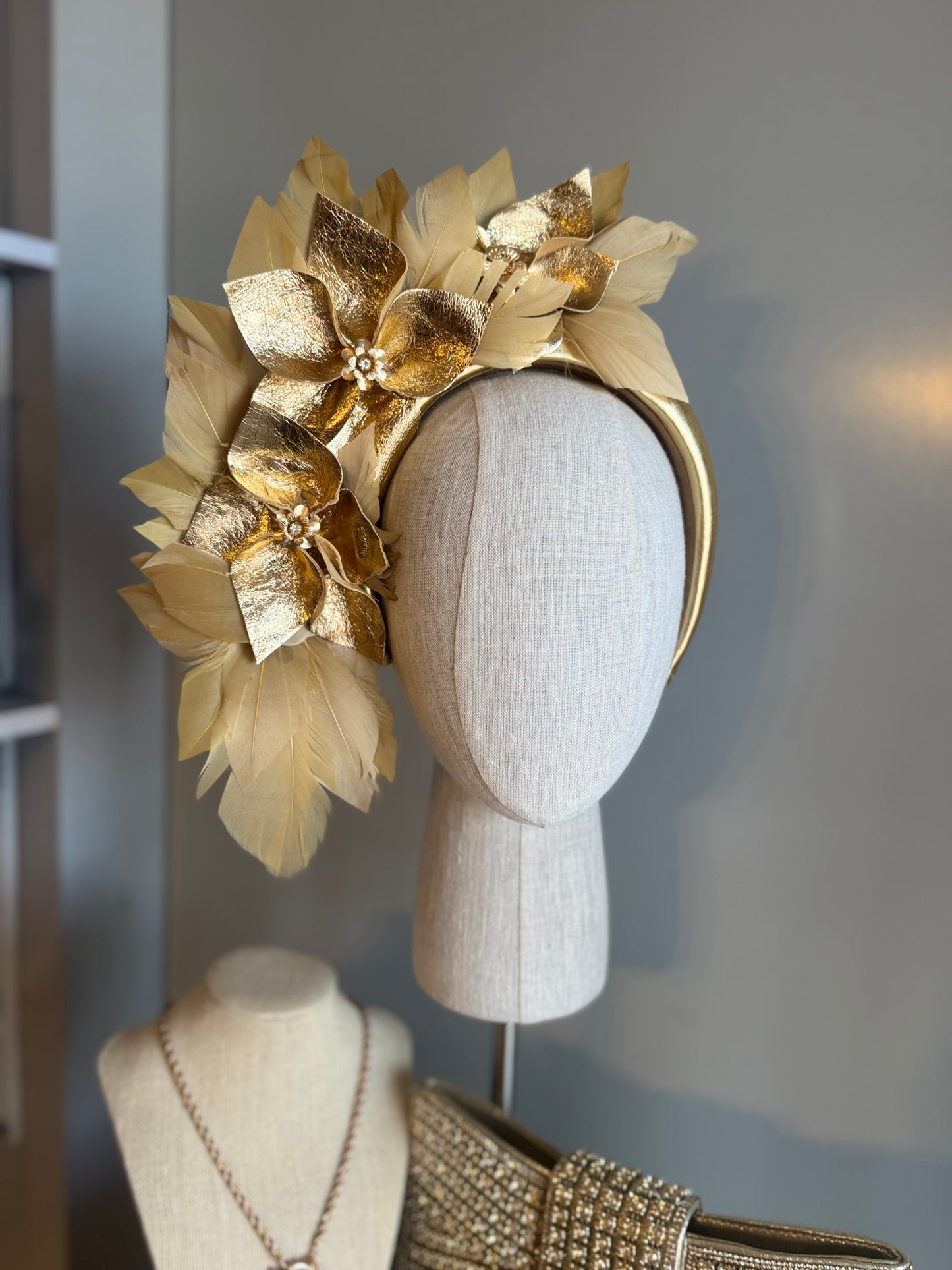 “Anna”Gold leather and feather statement