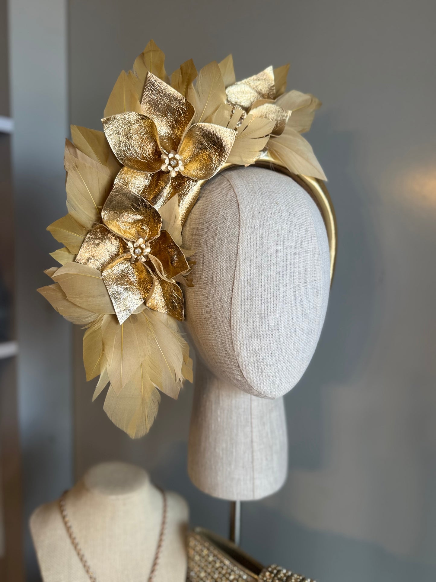 “Anna”Gold leather and feather statement