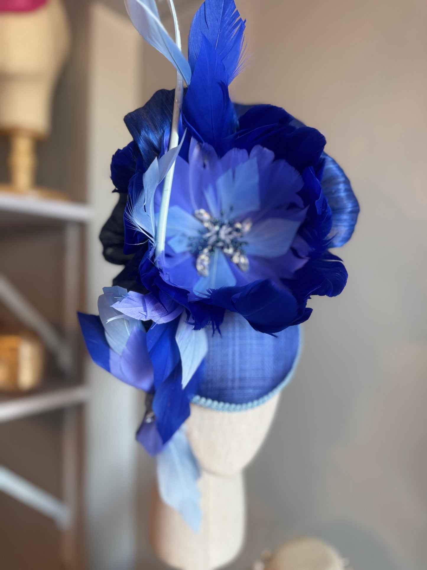 “Wren” blue feather statement