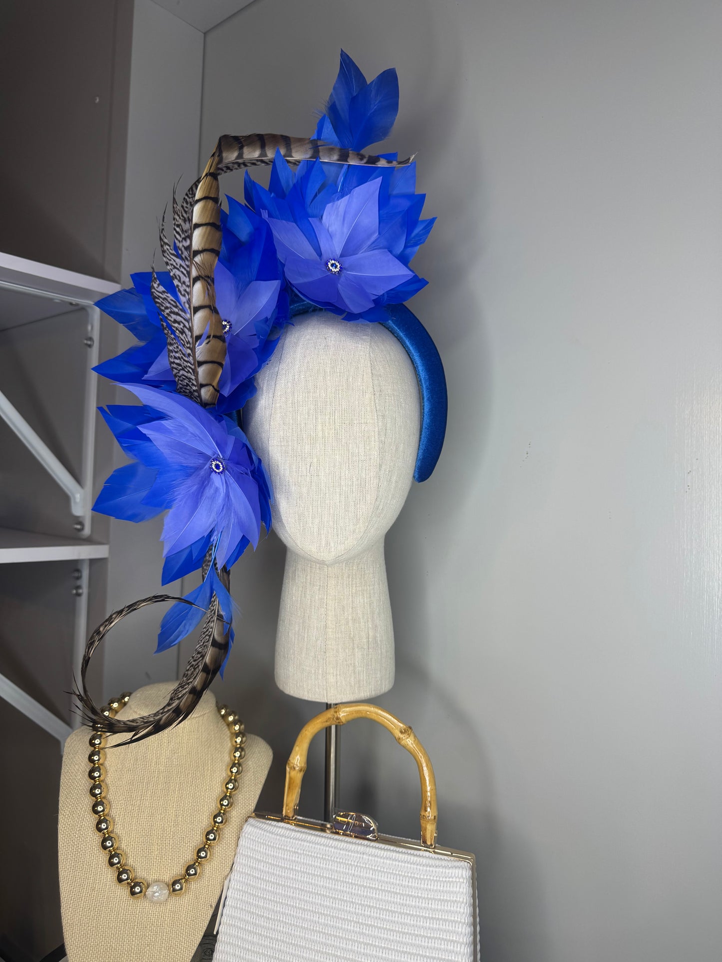 “Lola” blue feather statement