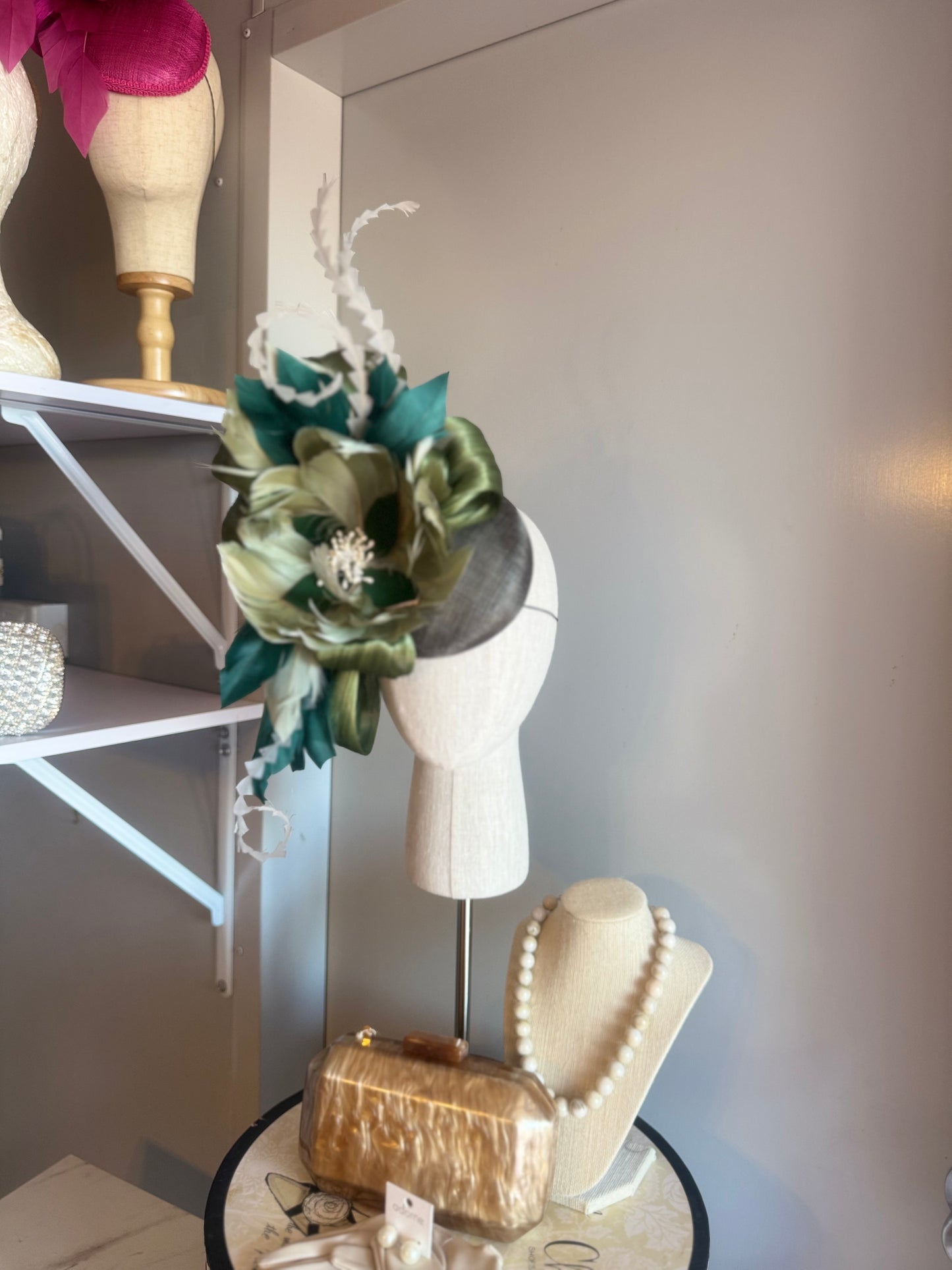 “August” green feather statement