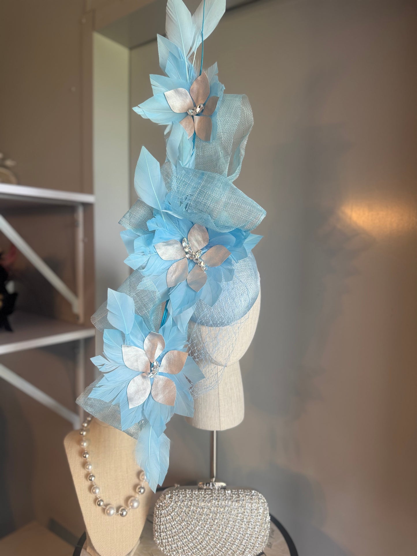 “Claudia” blue silver feather statement