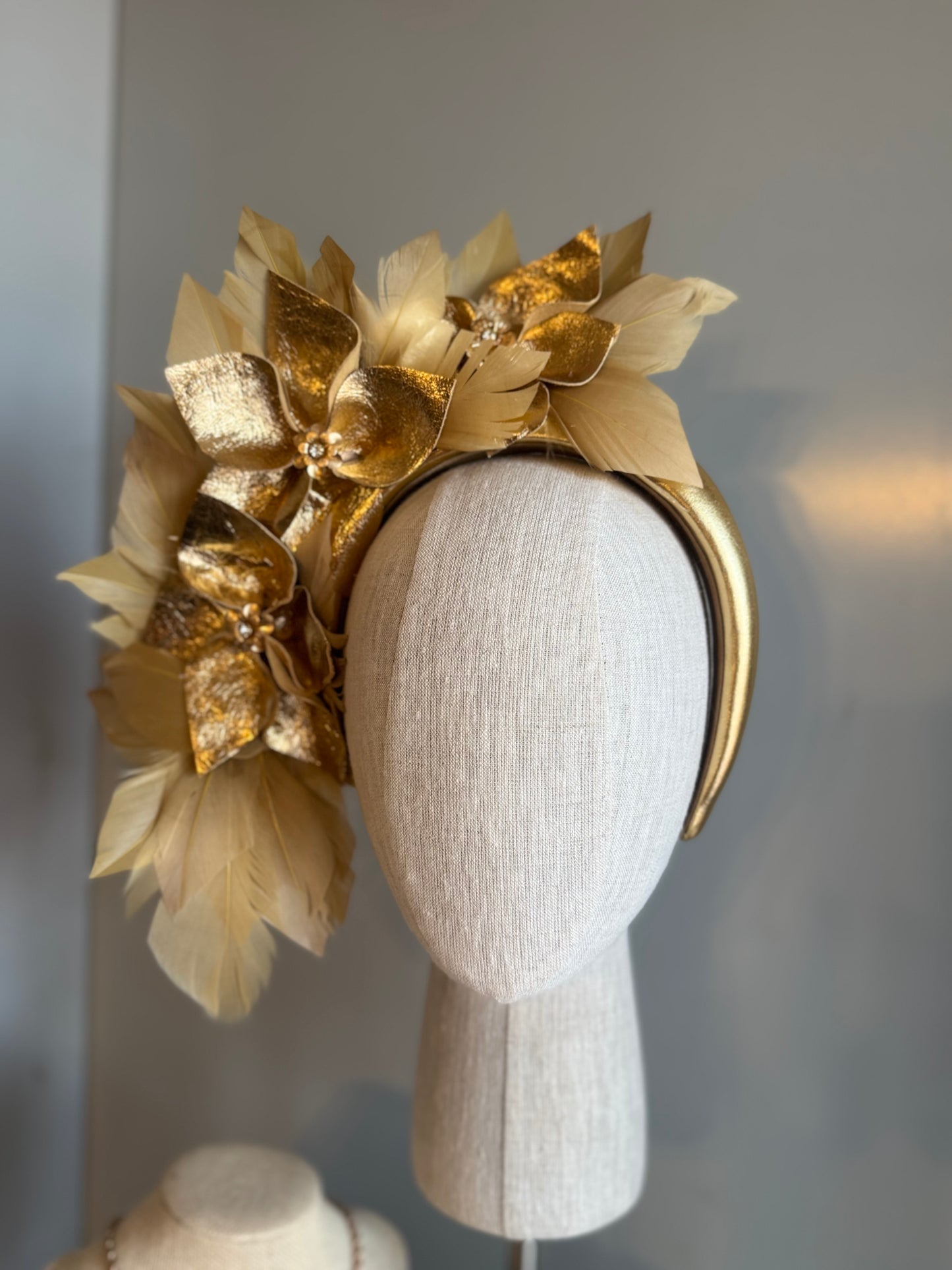 “Anna”Gold leather and feather statement