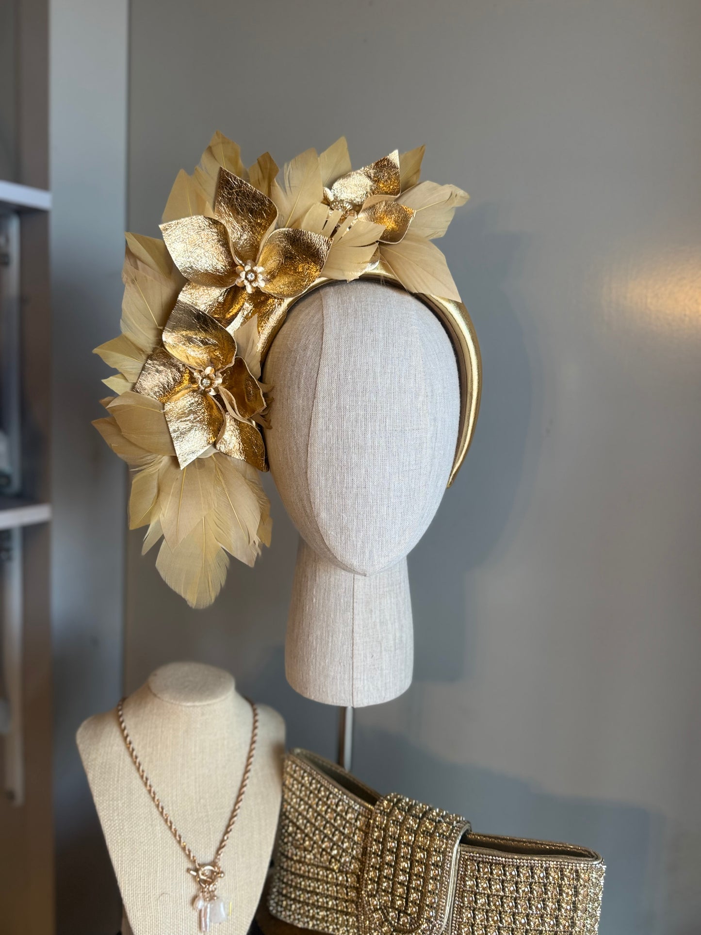 “Anna”Gold leather and feather statement