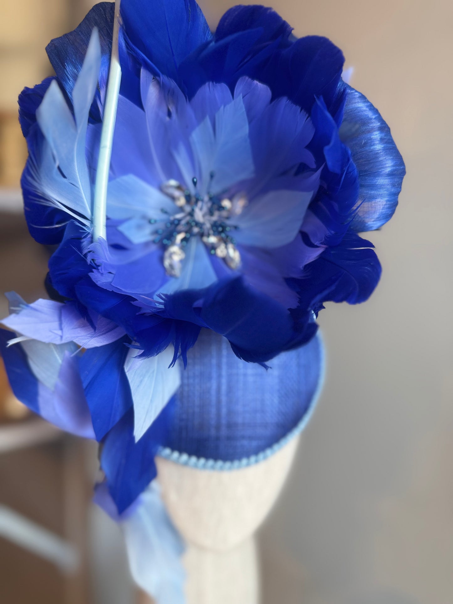 “Wren” blue feather statement