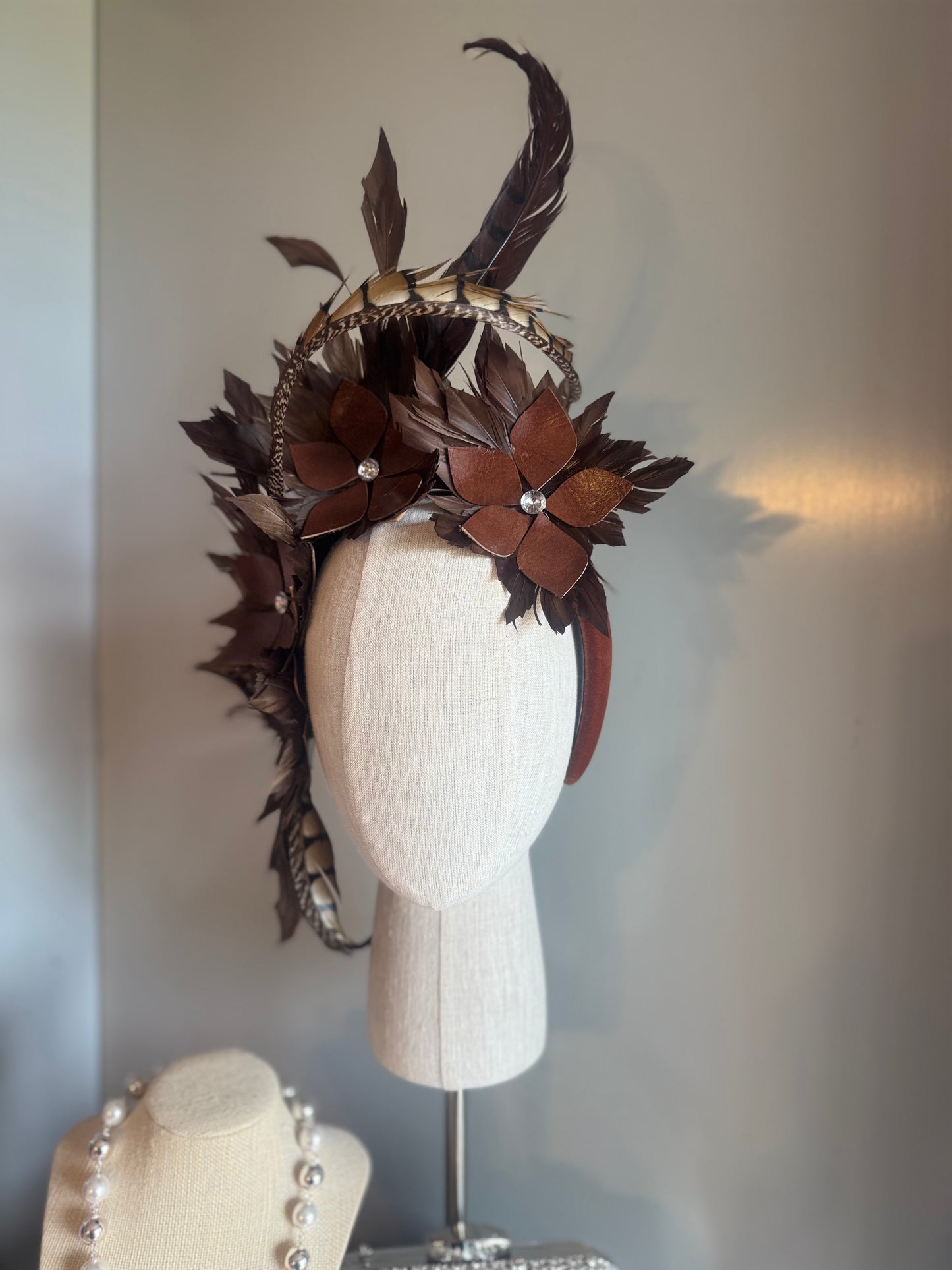 “Tempi” brown feather statement pillbox