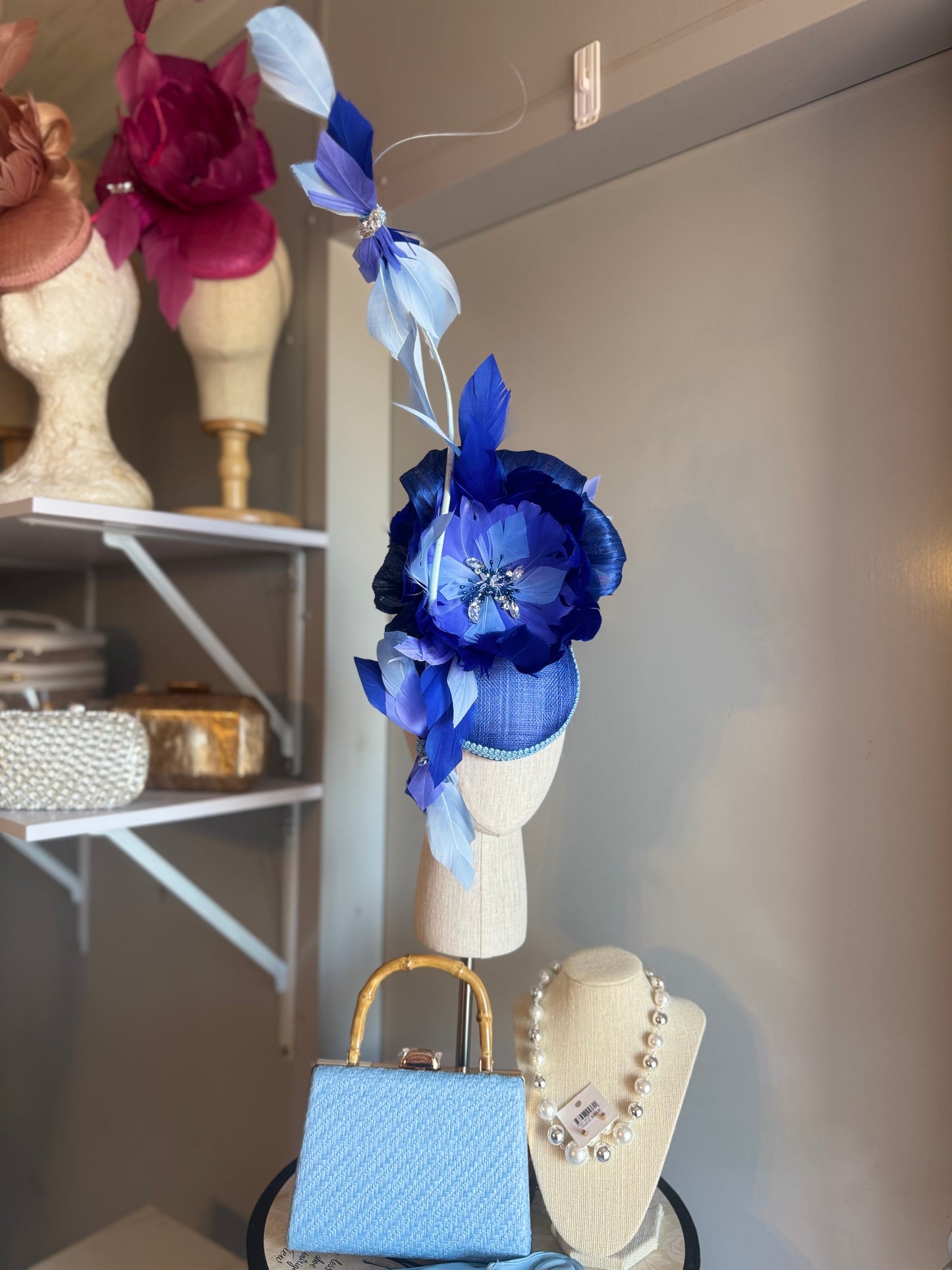 “Wren” blue feather statement