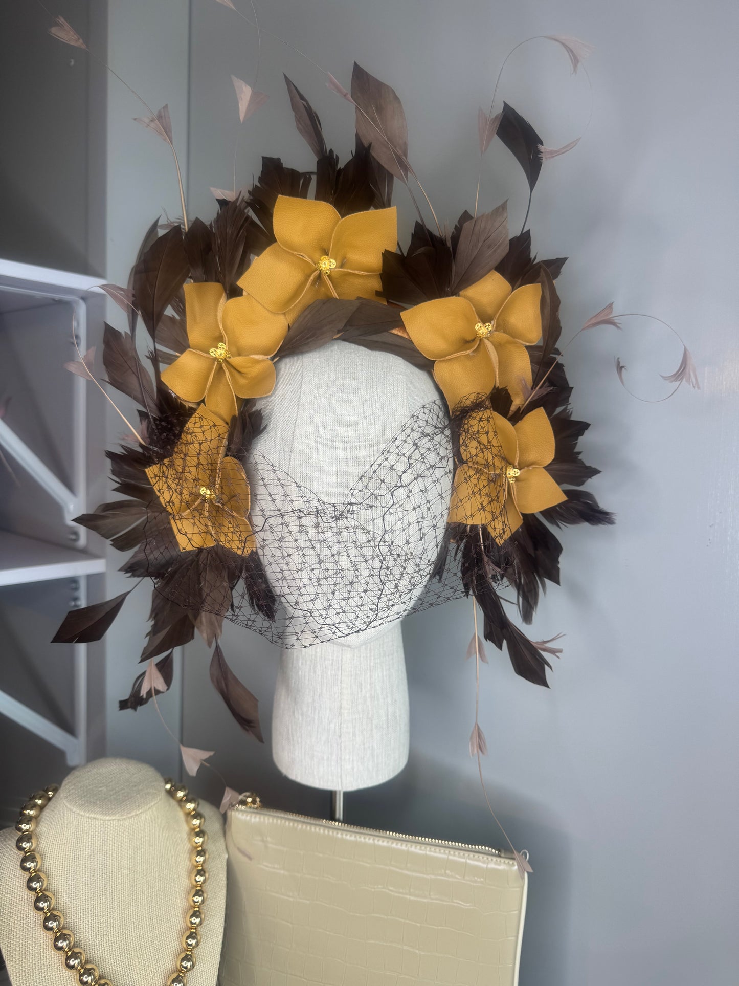 “Pippa” caramel mustard & chocolate leather & feather statement