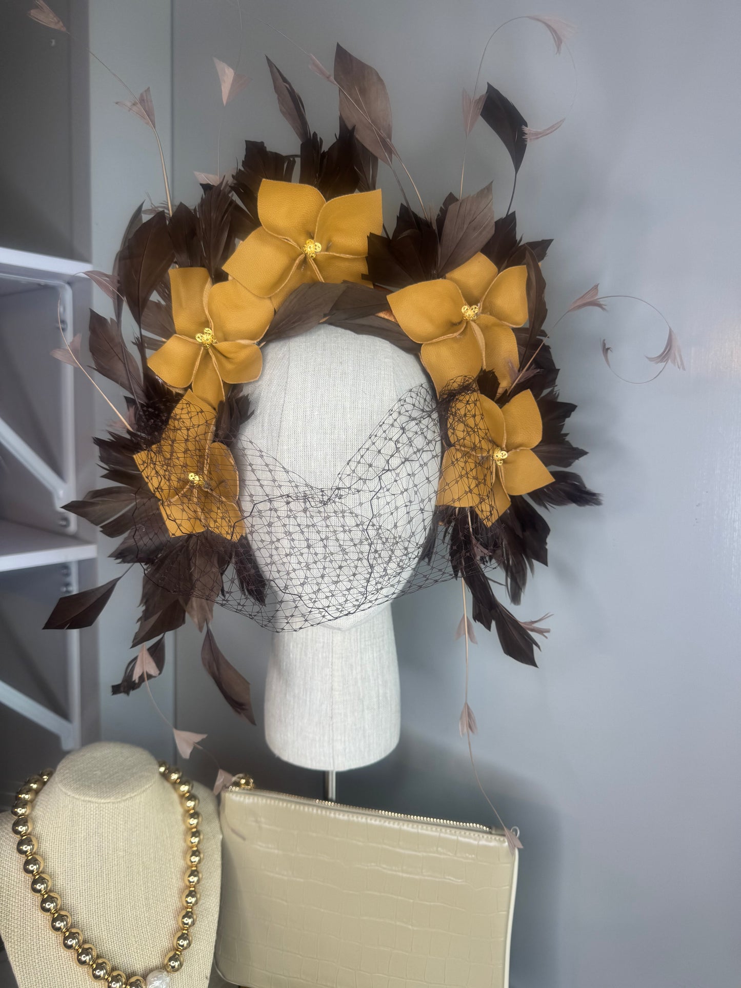 “Pippa” caramel mustard & chocolate leather & feather statement