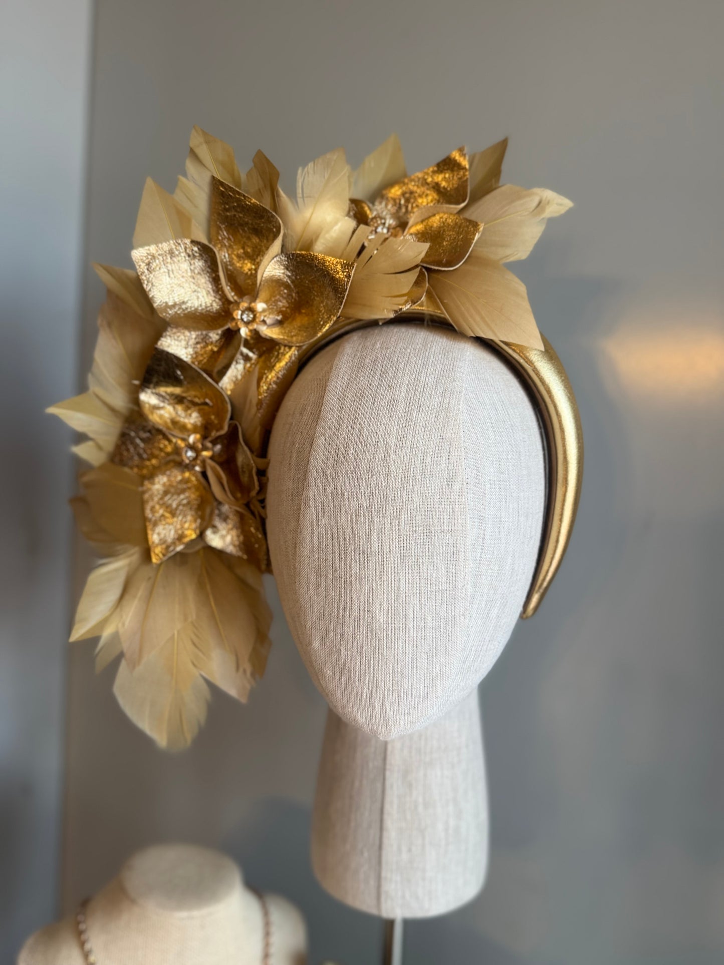 “Anna”Gold leather and feather statement