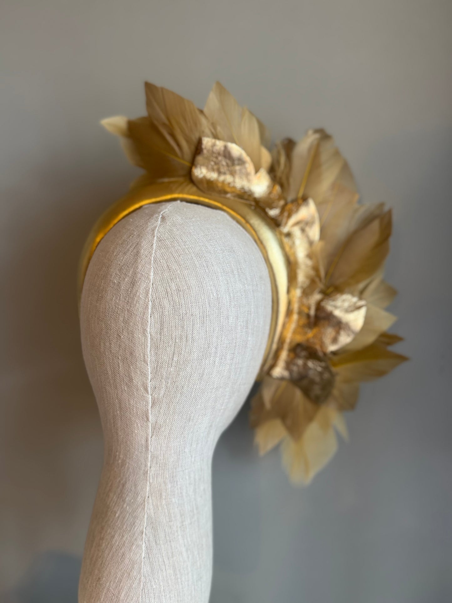 “Anna”Gold leather and feather statement