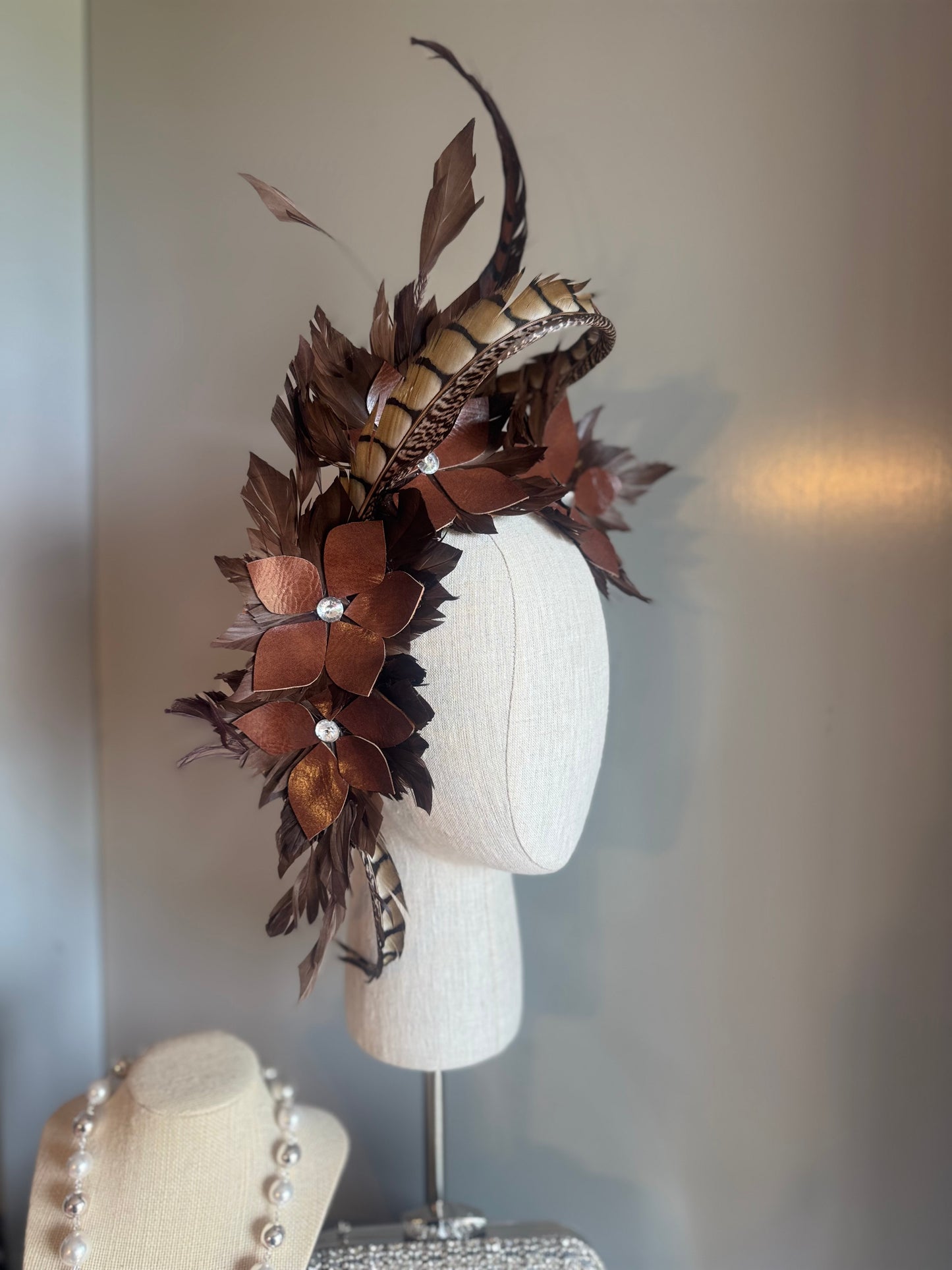 “Tempi” brown feather statement pillbox