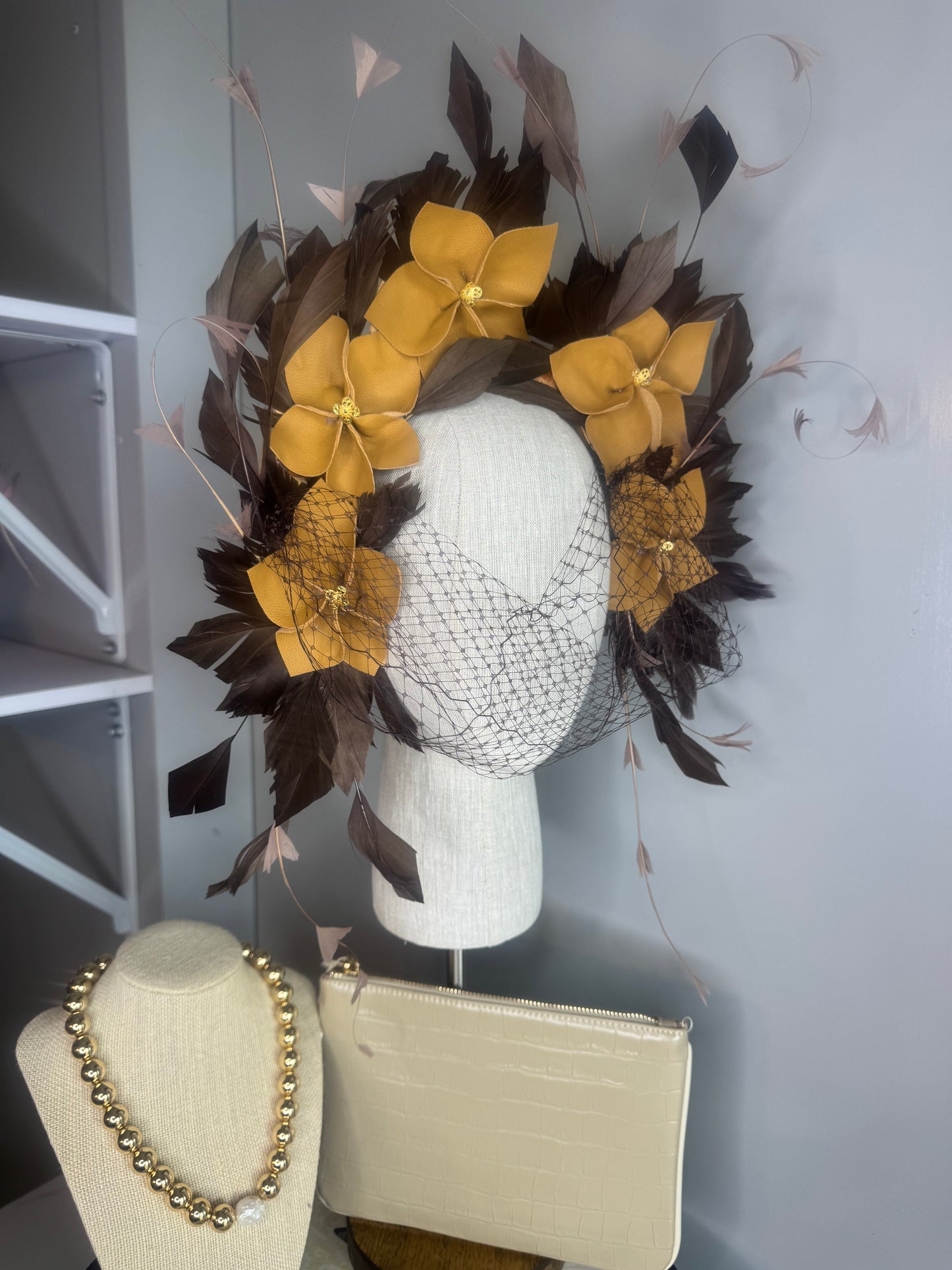 “Pippa” caramel mustard & chocolate leather & feather statement